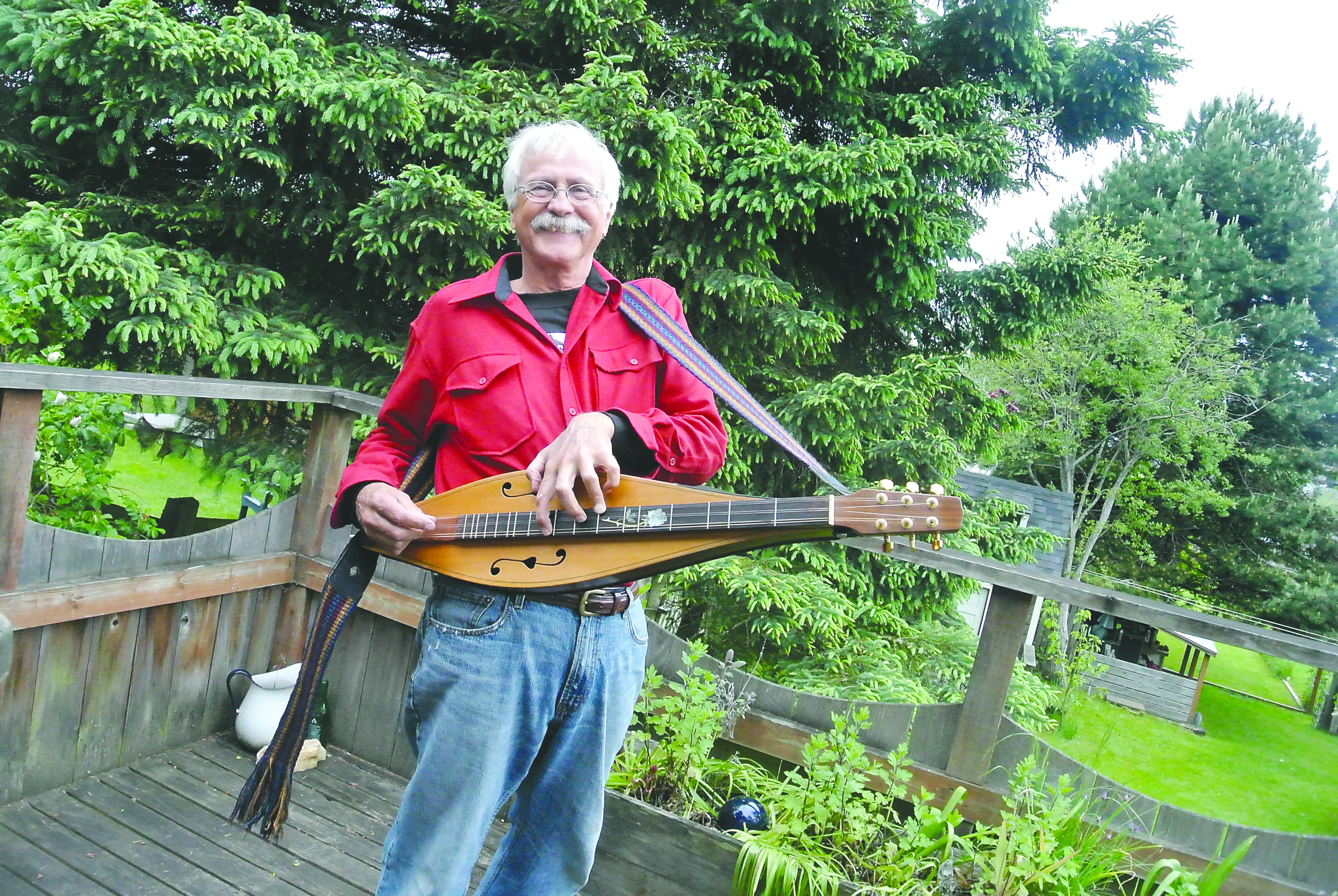 Robert Force and his dulcimer.  -- Photo by Charlie Bermant/Peninsula Daily News