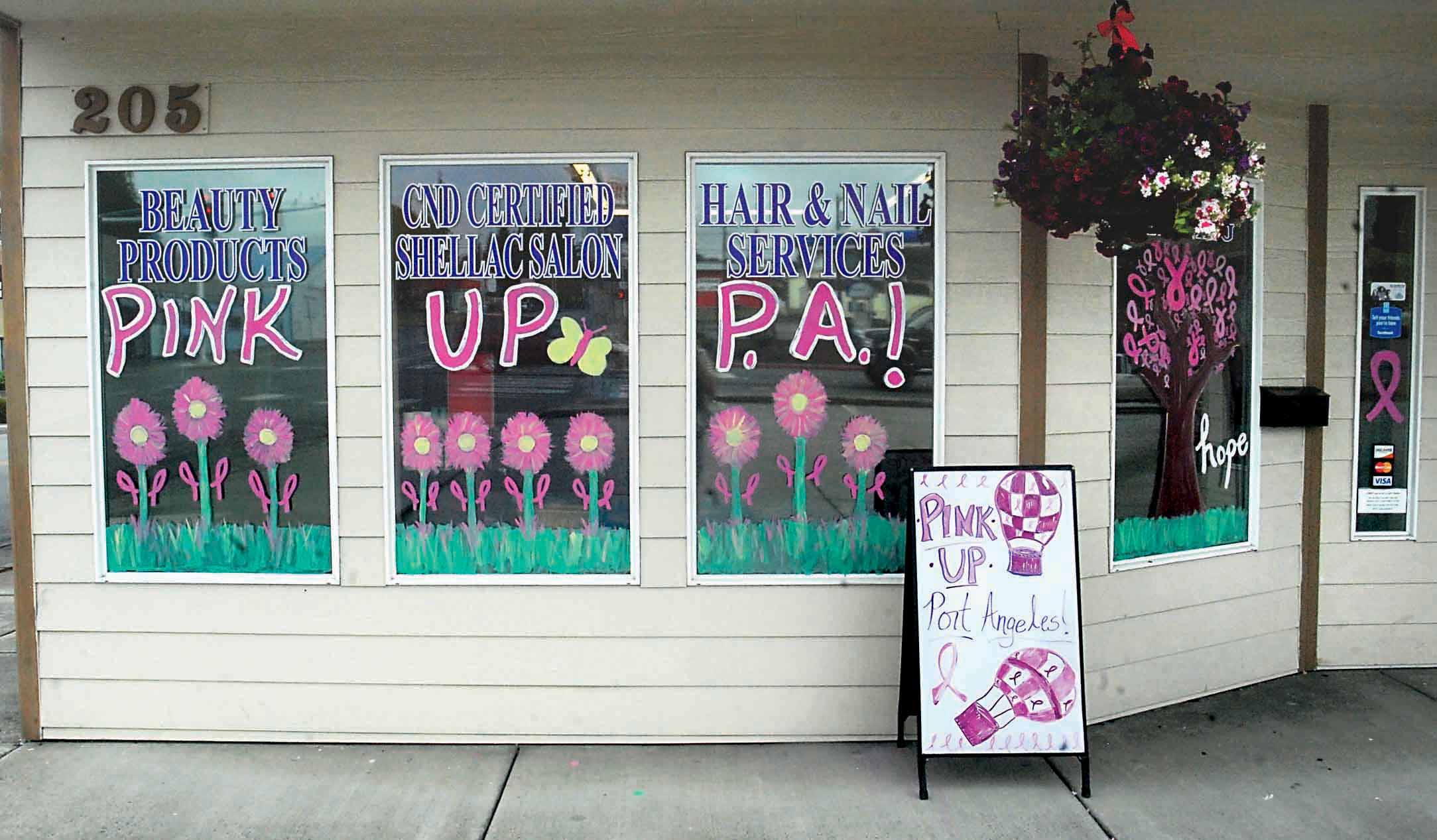 The front window of Angeles Beauty Supply & Salon was one of two decorated shop windows to take first place in the sixth annual Pink Up Port Angeles window contest. — Keith Thorpe/Peninsula Daily News