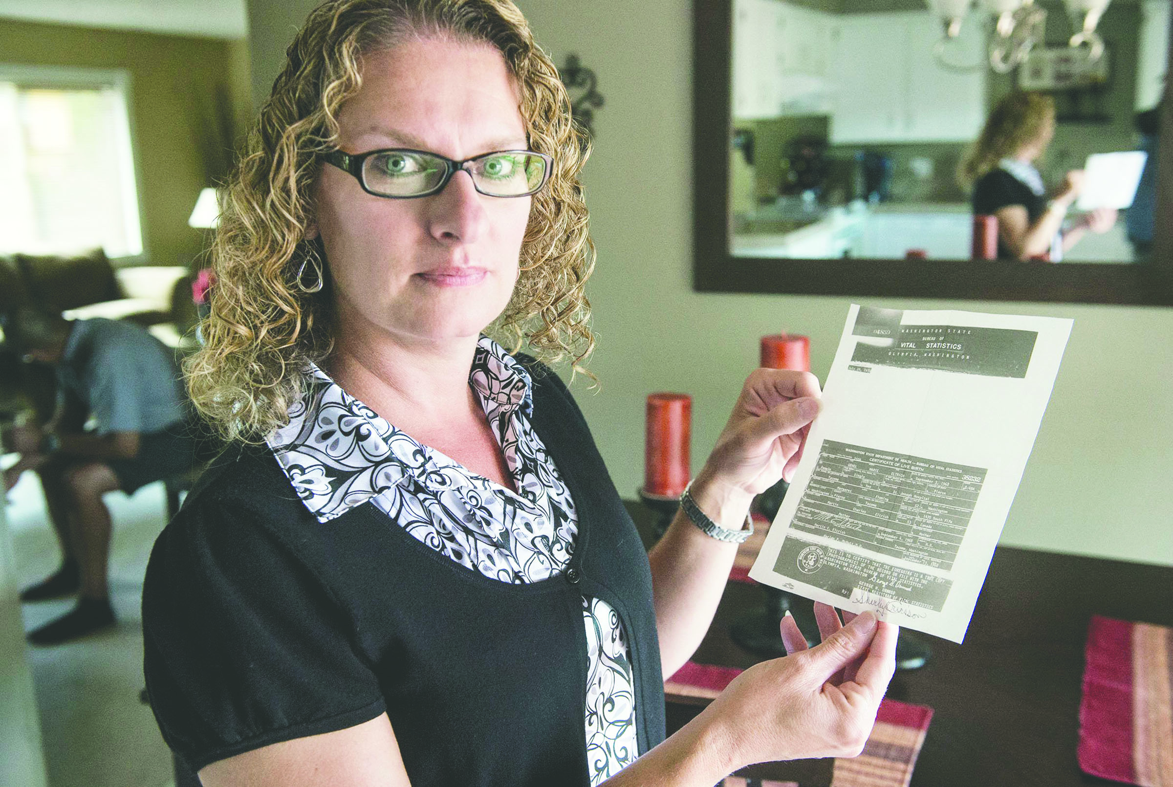 Genel Tucker of Bremerton is one of many people adopted in Washington who has filed to get her original birth certificate. Tucker hopes to at least get medical history records of her biological parents when a change in law takes effect today. — The Associated Press