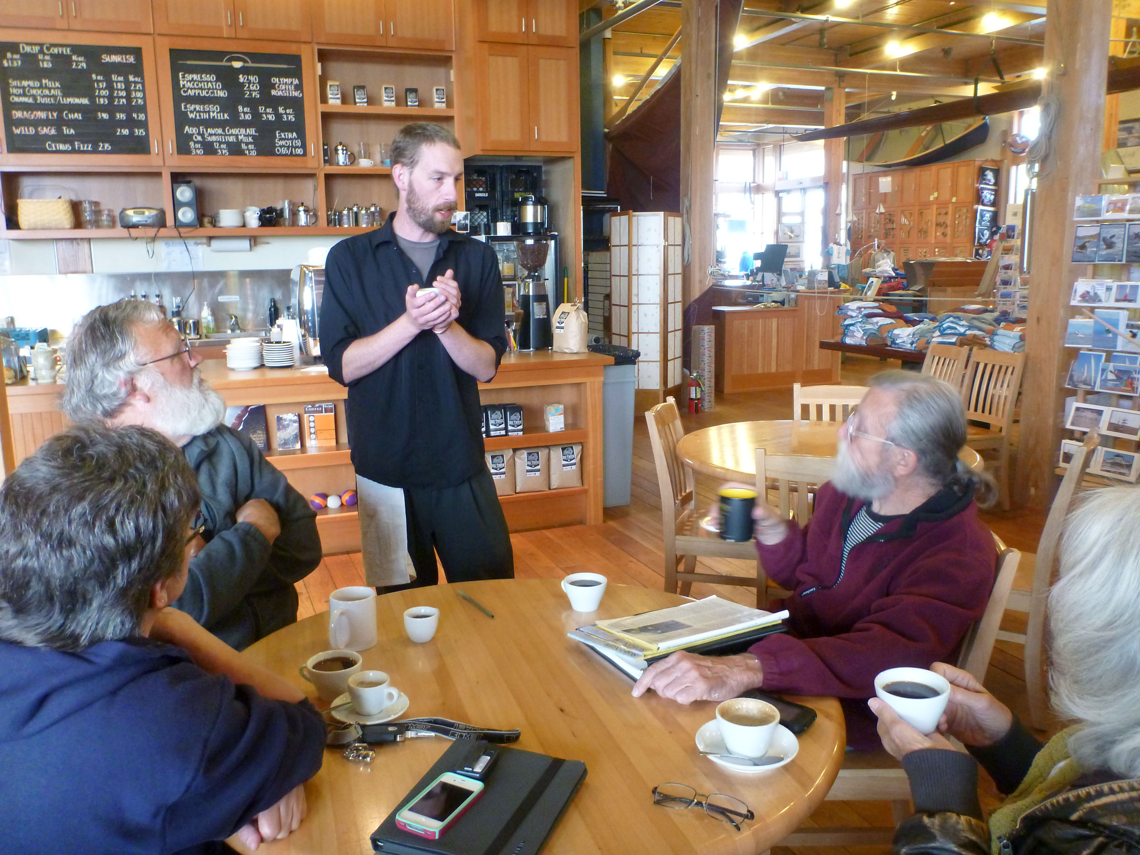 Joe Ruth talks with early morning customers