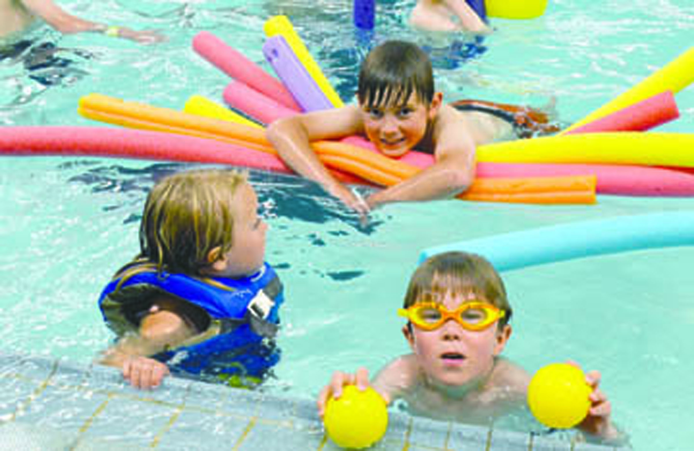 Children play in Port Townsend’s Mountain View Pool during Friday’s 50th anniversary party