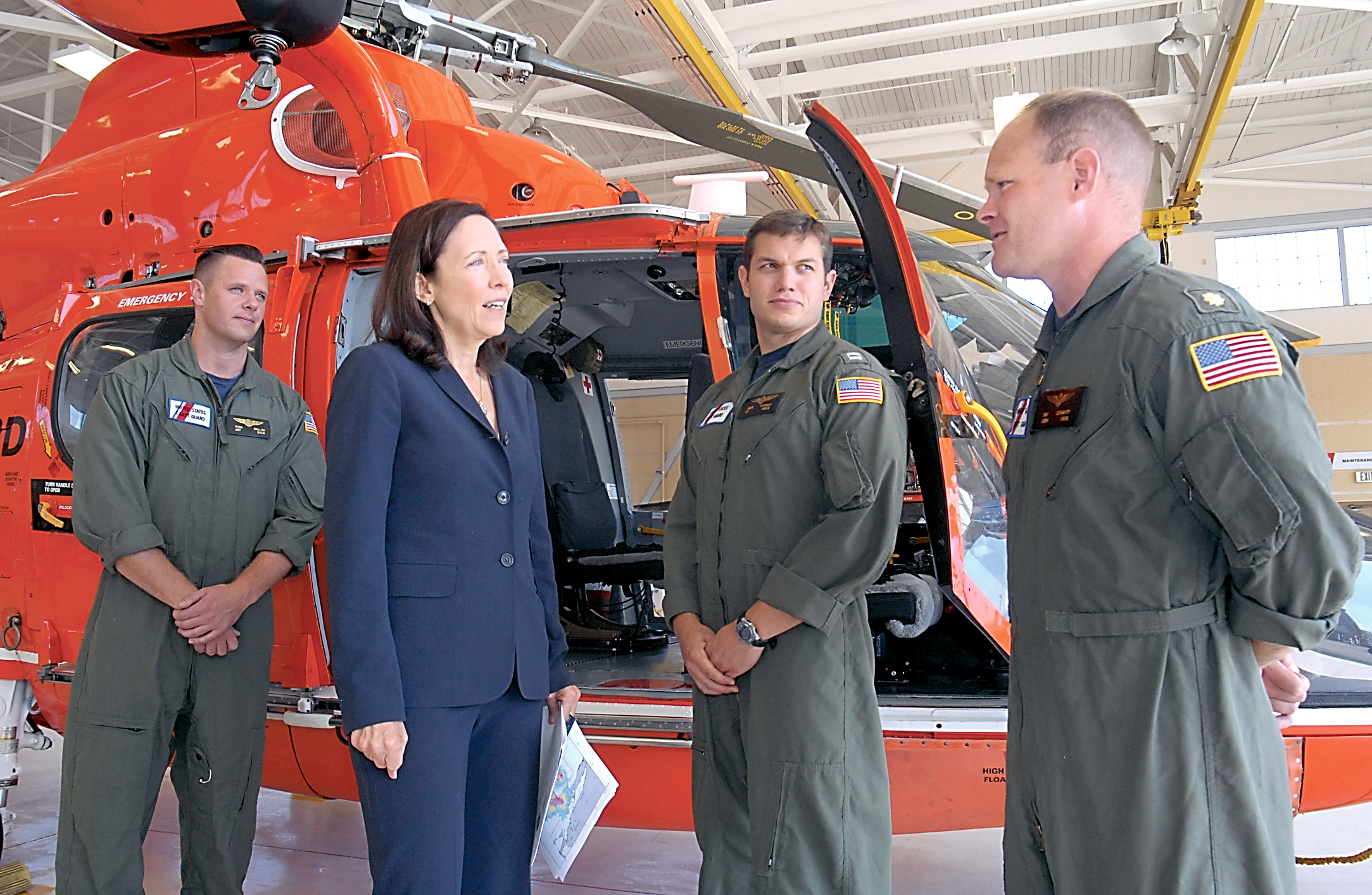 Sen. Maria Cantwell talks with the Coast Guard helicopter crew that rescued a mariner whose boat caught fire near Neah Bay a week ago. From left are Avionics Electrical Technician Ryan Hallam