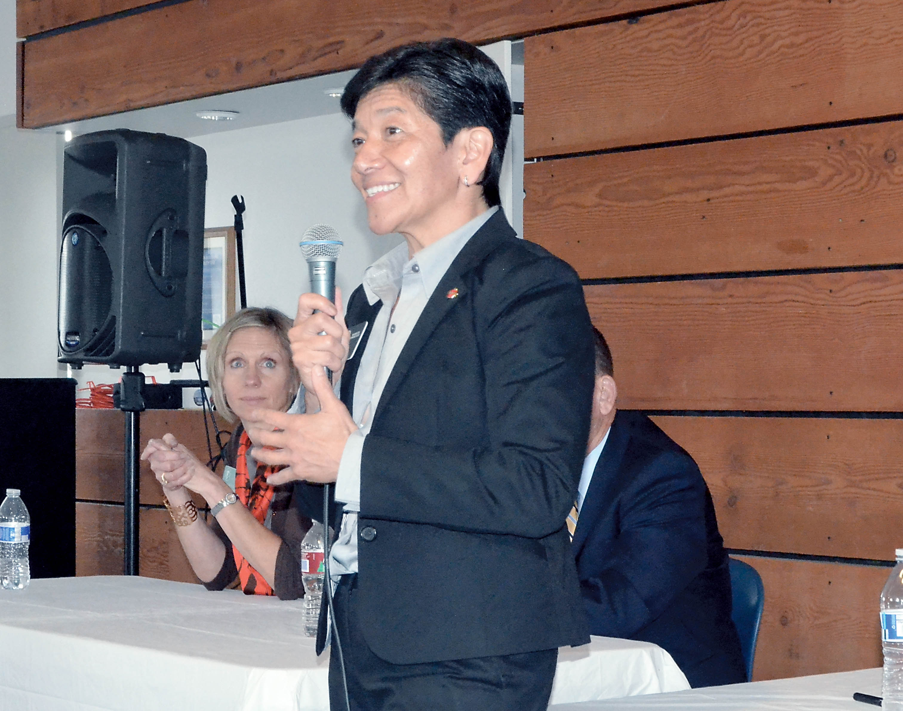 Washington State Supreme Court Justice Mary Yu speaks to a group on Friday night about legal issues. At left is Justice Debra Stephens. —Photo by Charlie Bermant/Peninsula Daily News
