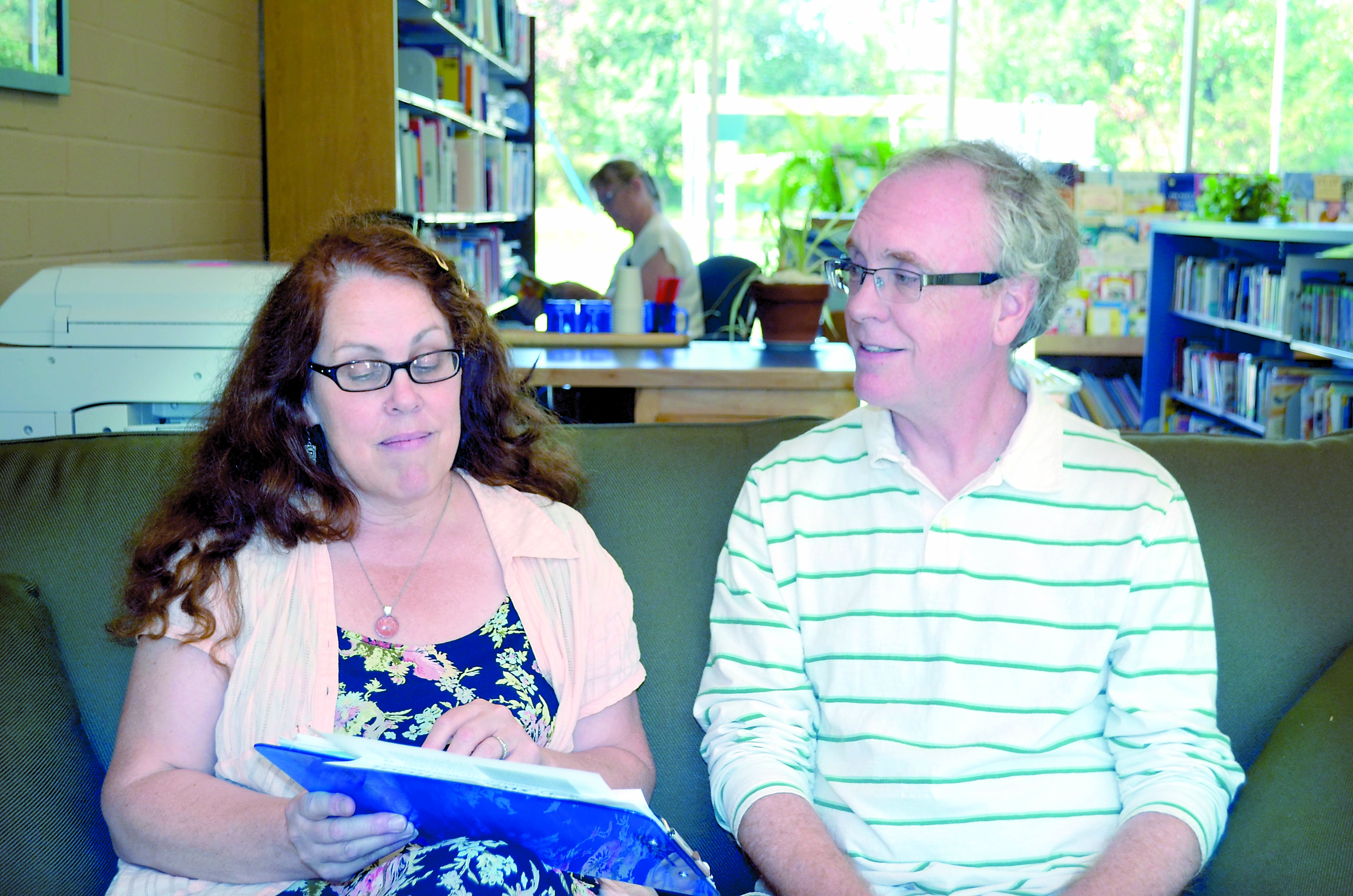 Swan School's assistant head Bonnie White and head Russ Yates discuss the new year-round schedule that begins today.  -- Photo by Charlie Bermant/Peninsula Daily News