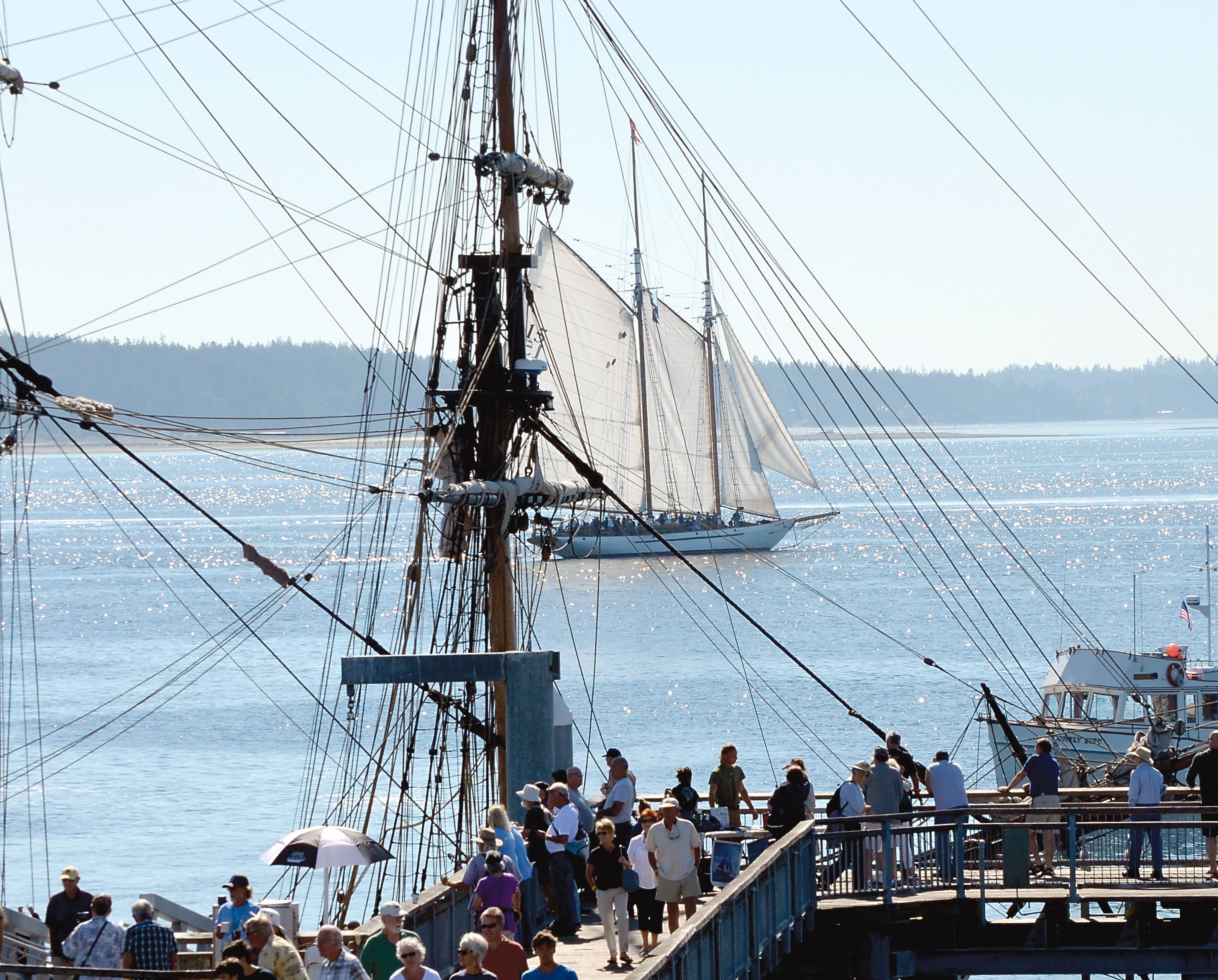 The schooner Adventuress is seen through the rigging of the Lady Washington on Saturday. Charlie Bermant/Peninsula Daily News