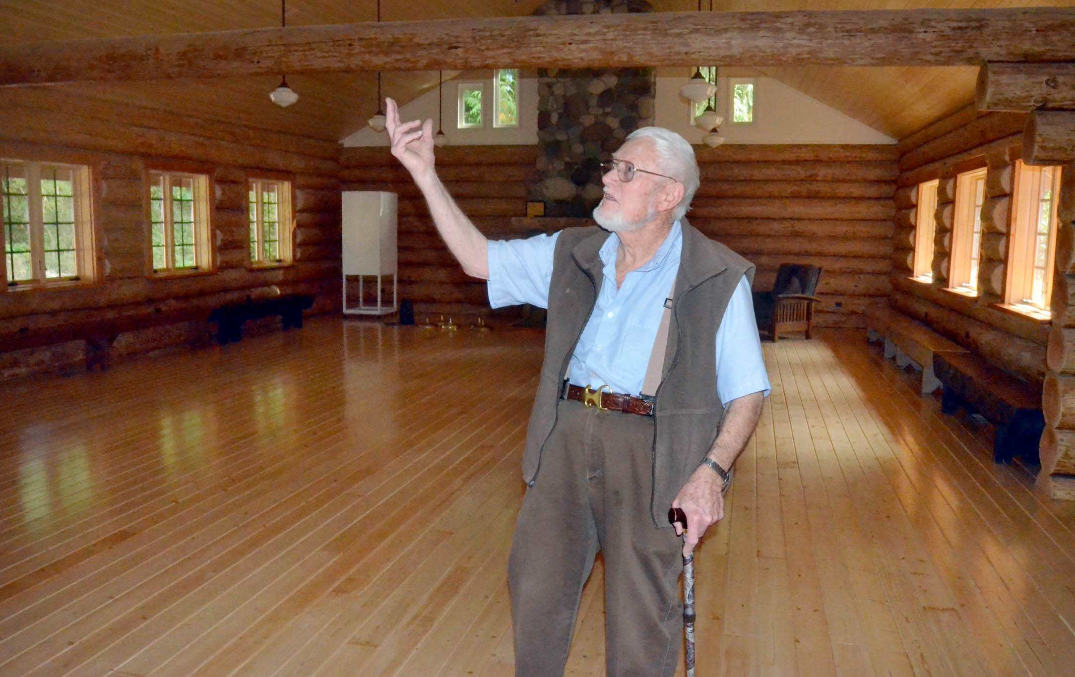 Boy Scout board member Norm Stevens makes a last-minute inspection of the new cabin