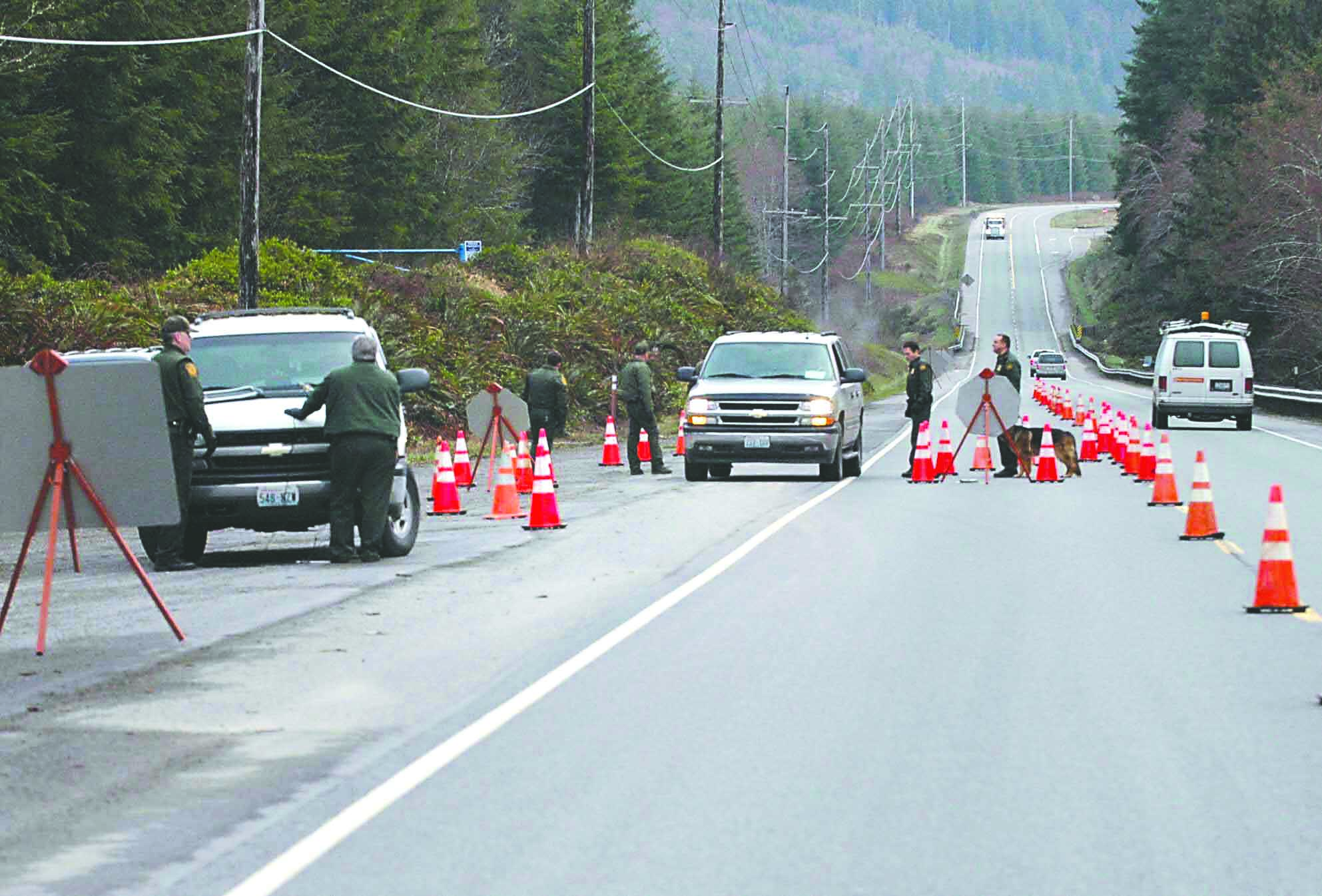 This Border Patrol checkpoint in August 2008 diverts a lane of U.S. Highway 101 traffic northeast of Forks. It was one of several that spurred the now-settled lawsuit.  -- Photo by Lonnie Archibald/for Peninsula Daily News.