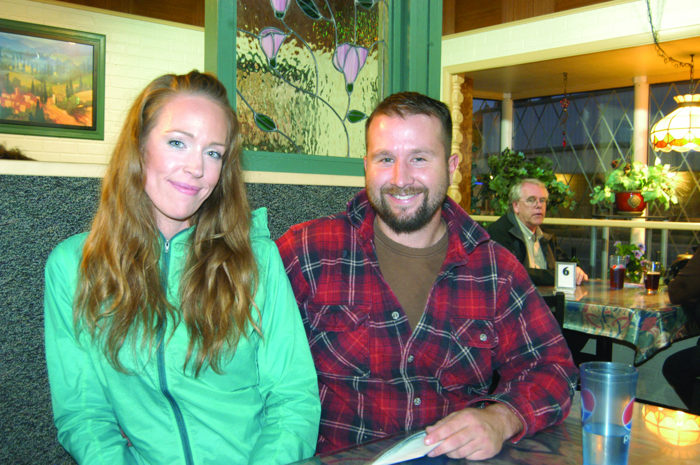 Kristy Davis and Jordan Bond at Gordy's Pizza & Pasta in Port Angeles. Bond's truck was damaged when he used it to stop a driver after an alleged hit-and-run. Rob Ollikainen/Peninsula Daily News