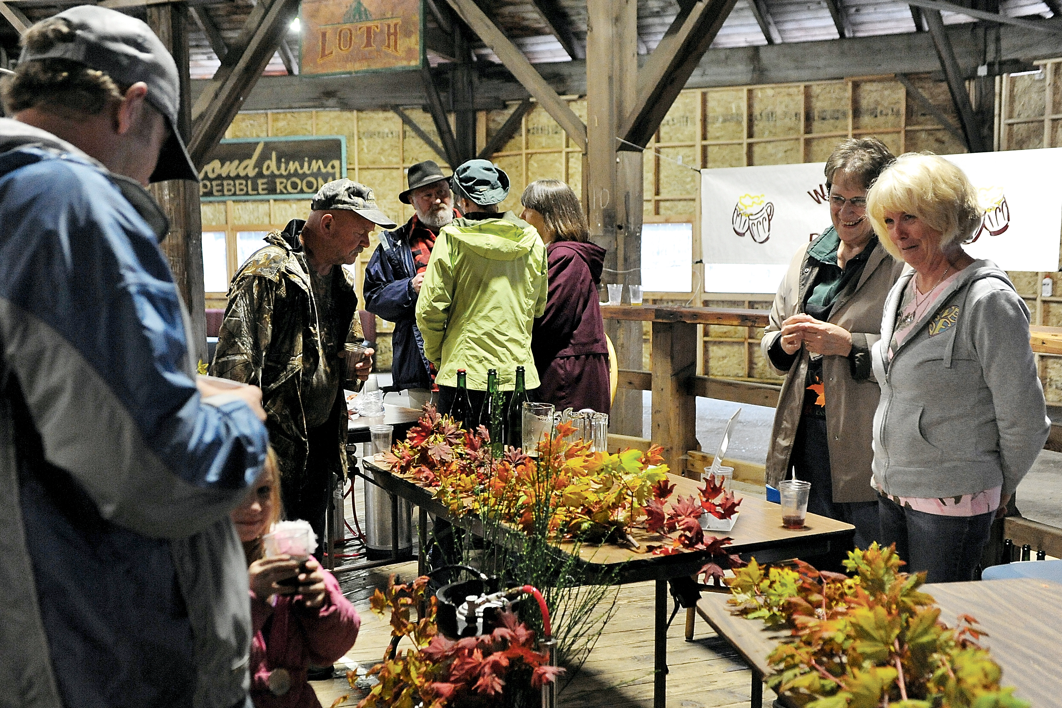 Groups gather to test wine and home brew during the Fish N Brew at the Old Mill Roundhouse in Forks in 2013 during the Hickory Shirt-Heritage Days. — Lonnie Archibald/for Peninsula Daily News