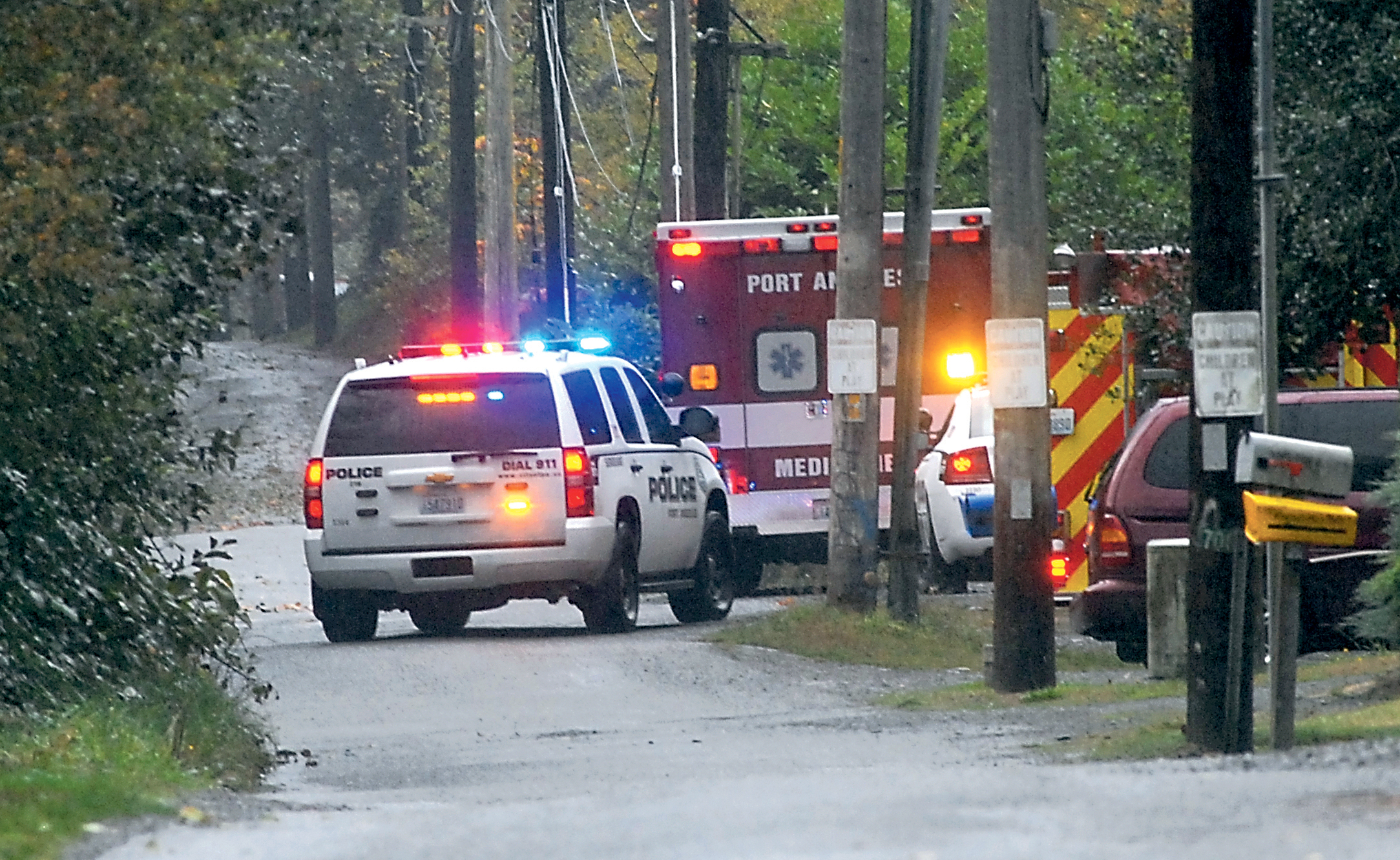 Police and medical vehicles converge at the base of the Eighth Street bridge over Valley Creek in Port Angeles after a person jumped from the bridge. Keith Thorpe/Peninsula Daily News