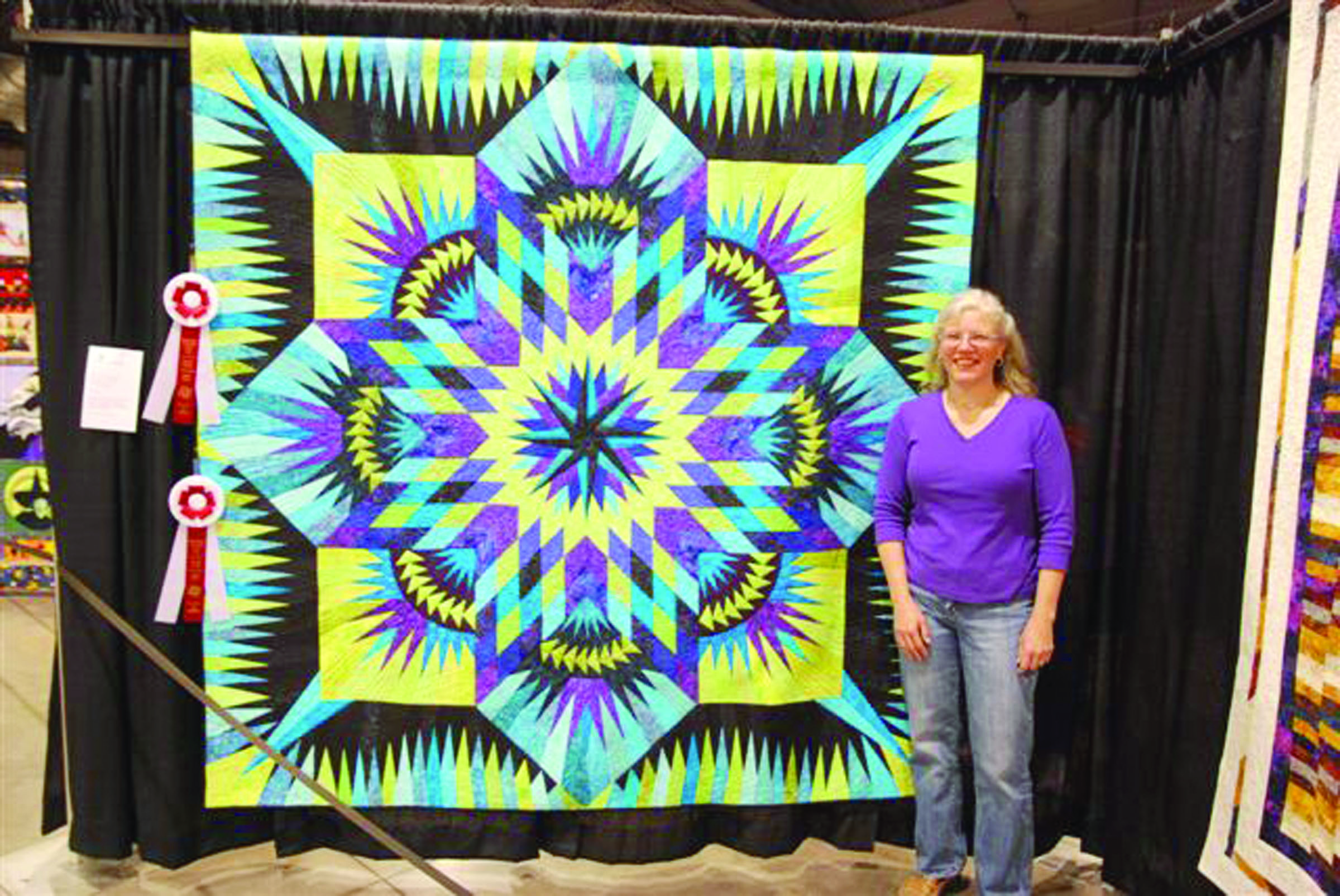 Carmen Czachor receives second place in the large-quilt category at the recent Northwest Quilting Expo in Portland