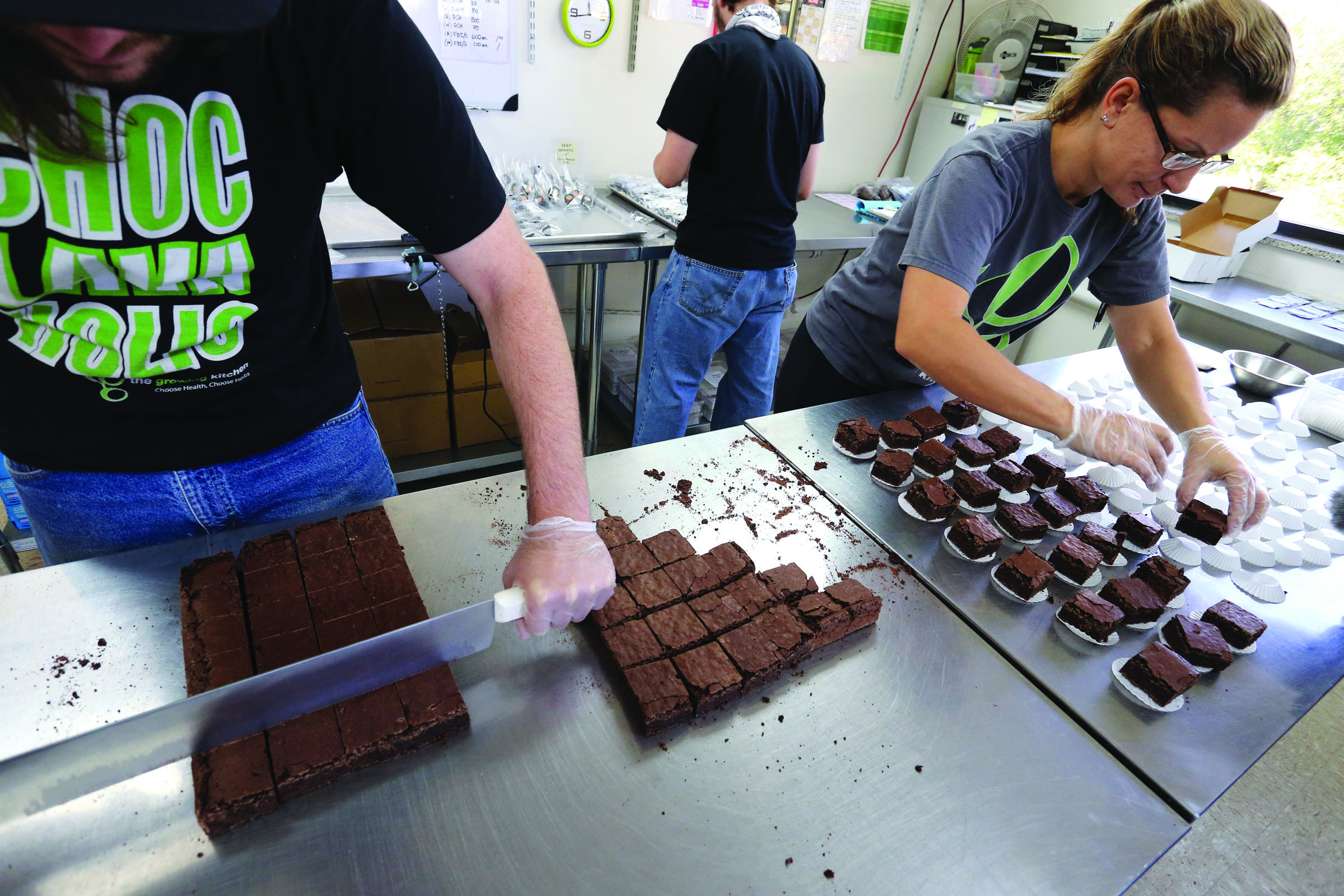 Smaller-dose pot-infused brownies are divided and packaged at The Growing Kitchen in Boulder