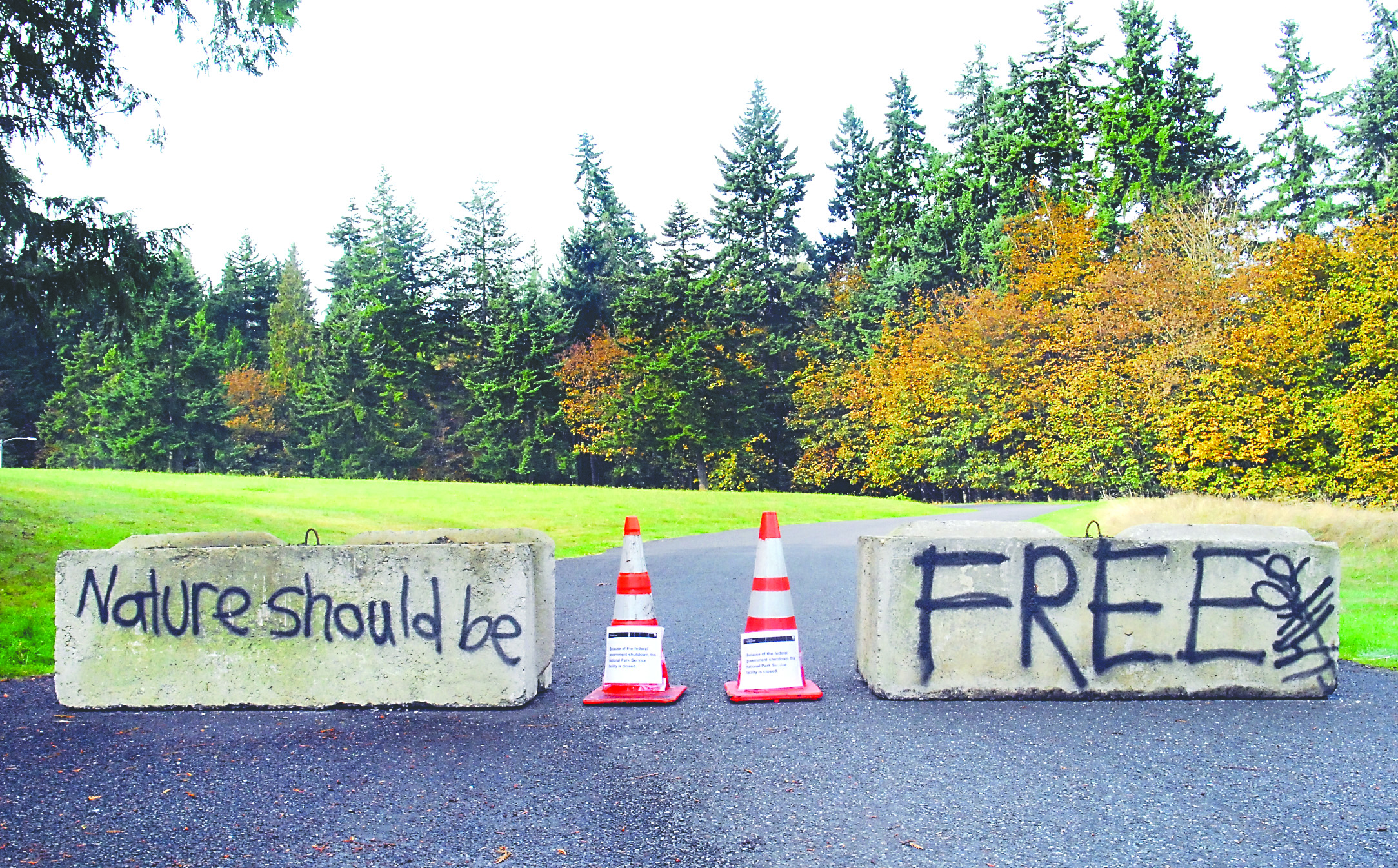 Graffiti were found written on the concrete barriers blocking an entrance to the Olympic National Park Visitor Center in Port Angeles.  -- Photo by Keith Thorpe/Peninsula Daily News