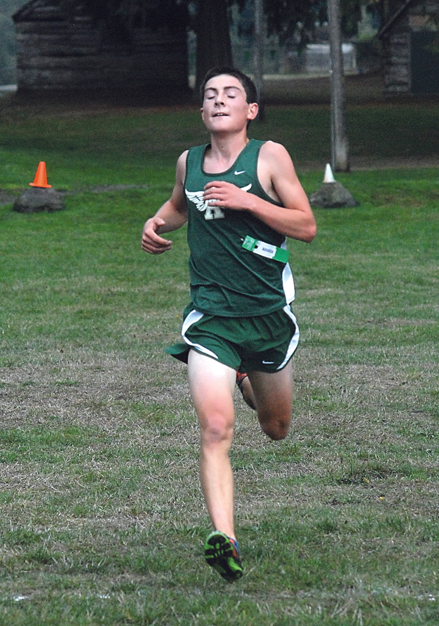 Port Angeles' Peter Butler approaches the finish line to take first at Lincoln Park in Port Angeles. Keith Thorpe/Peninsula Daily News