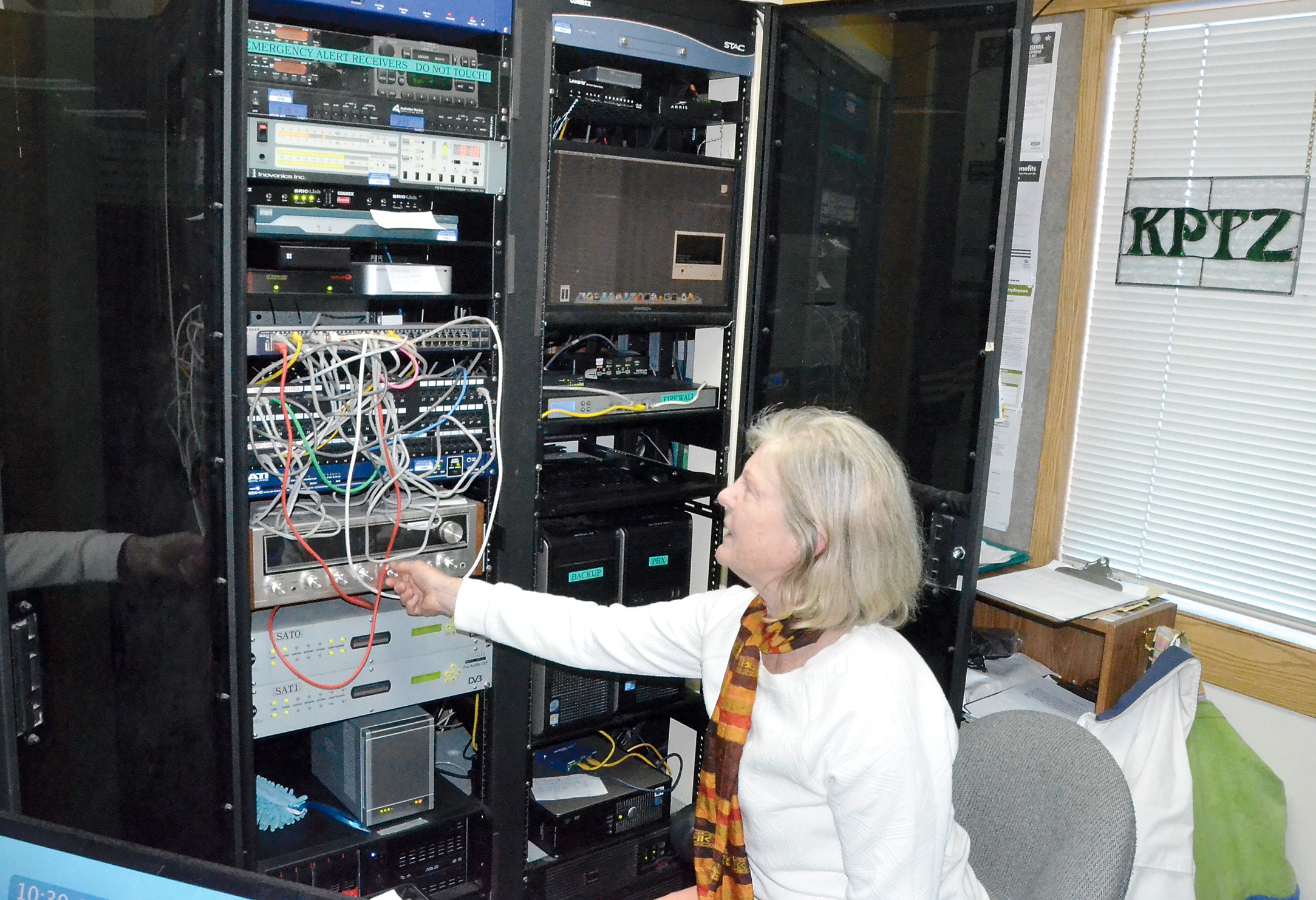 KPTZ station manager Nora Petrich surveys some of the equipment that needs replacement. The fall fund drive begins today. —Photo by Charlie Bermant/Peninsula Daily News