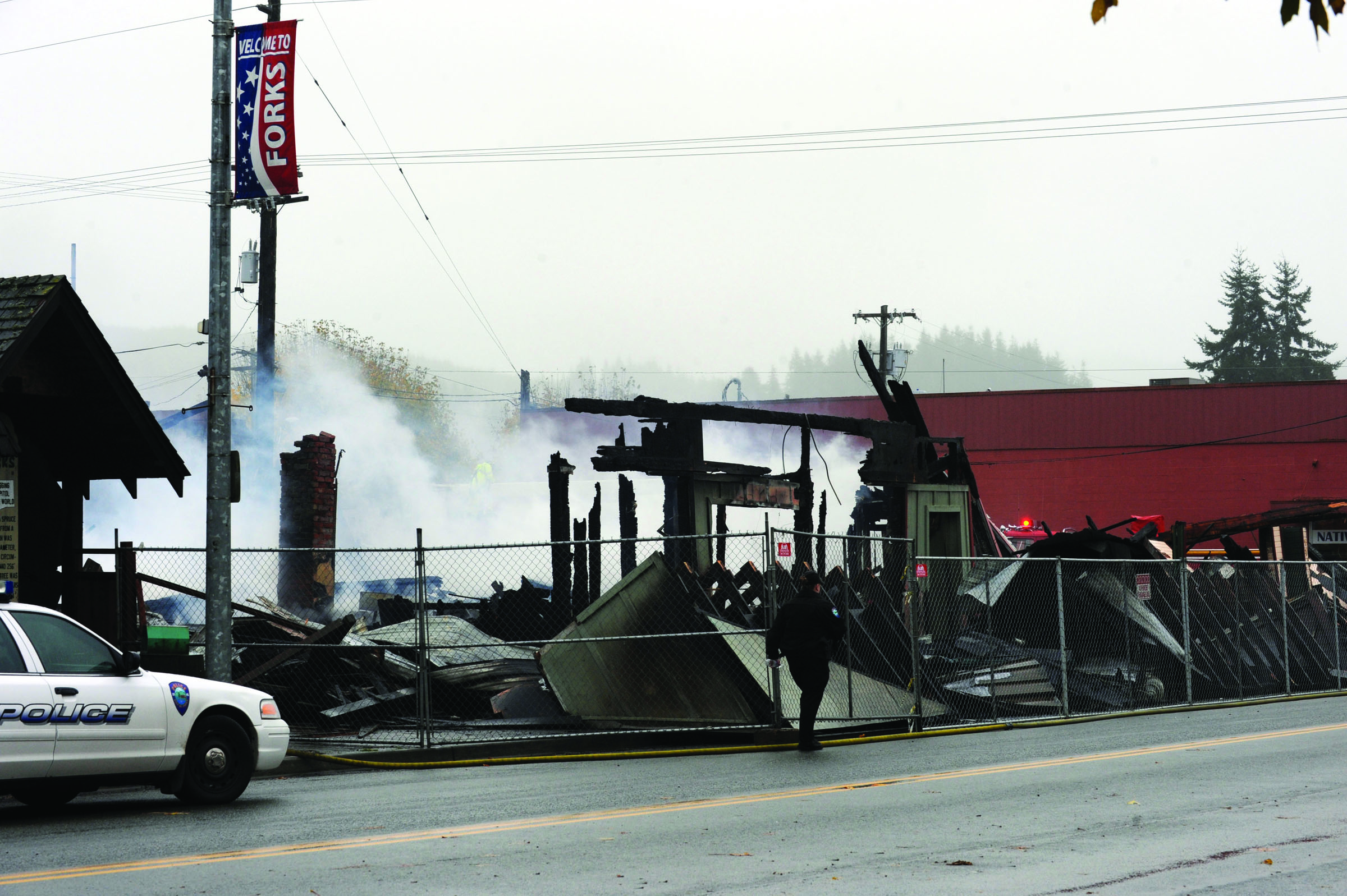 Burned rubble is all that remains of the IOOF hall and an adjacent store building that once housed Olympic Pharmacy — and more recently