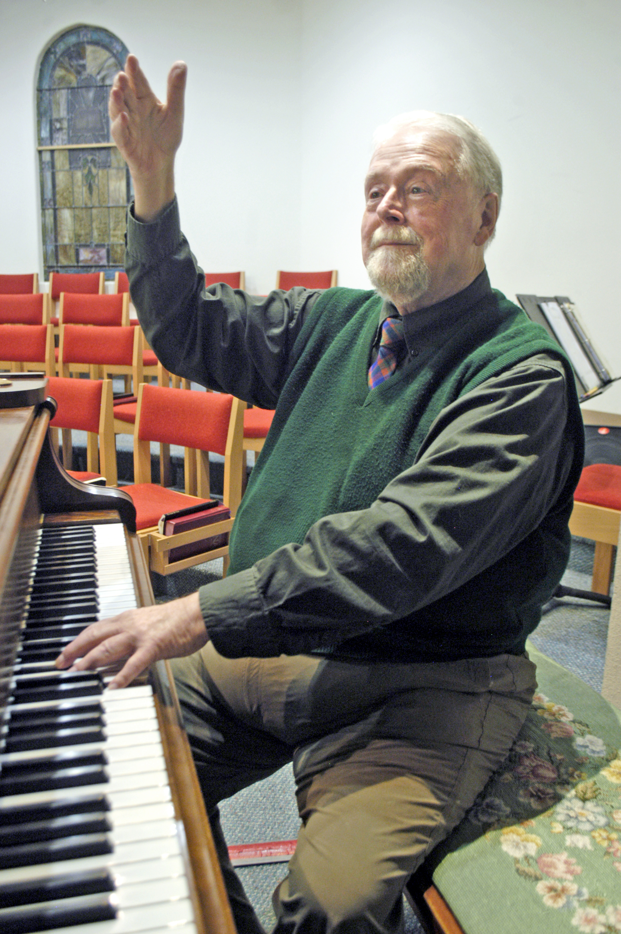Jerome Wright directs the Olympic Girls Choir on Tuesday evening at Trinity United Methodist Church in Sequim. Chris McDaniel/Peninsula Daily News