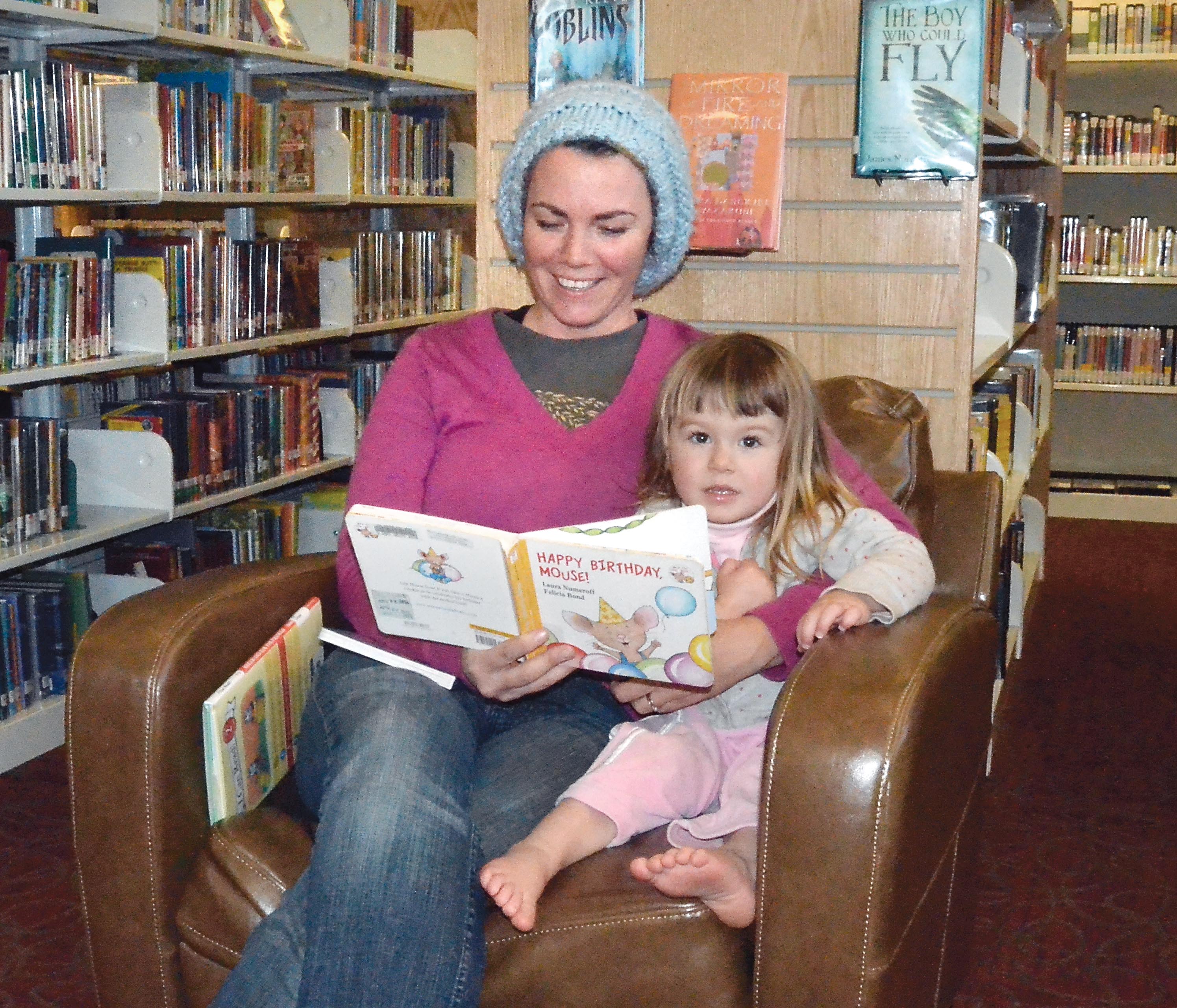 Katie Boyle reads to her 2-year-old daughter