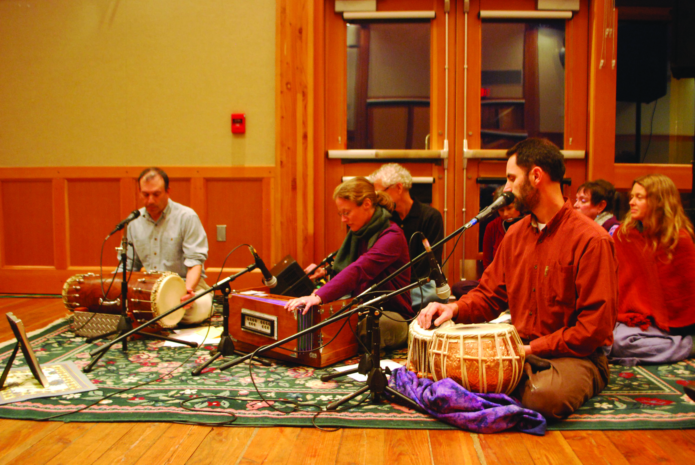 Members of Amma Satsang end Sunday’s interfaith service with a chant. From left: Saul Samsky