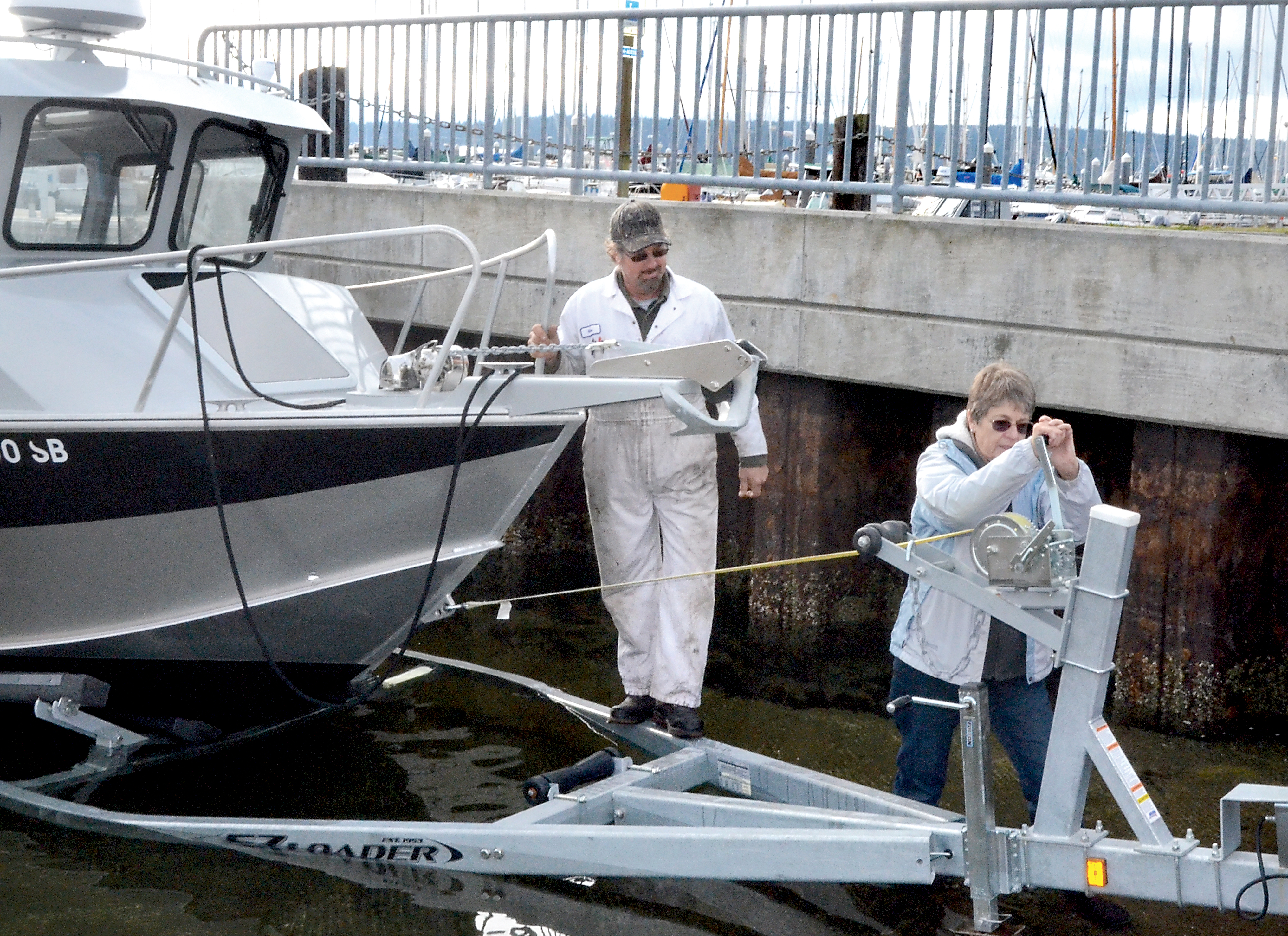 Sally Gecas of Port Ludlow turns the crank that lifts her 7