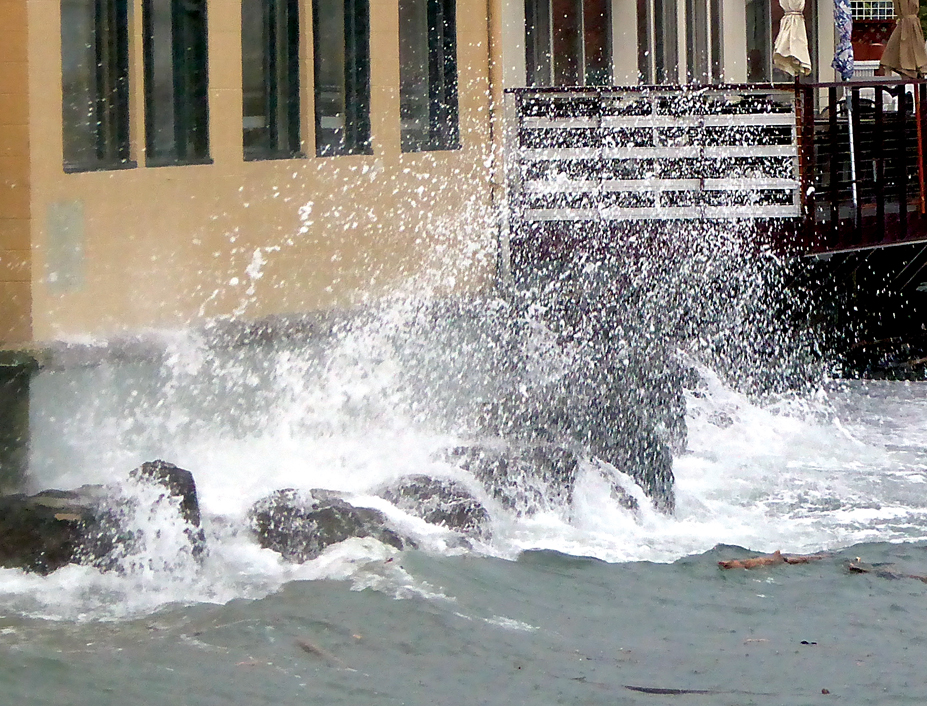 High winds and tide batter the outside of Port Townsend's Better Living Through Coffee on Thursday. Charlie Bermant/Peninsula Daily News