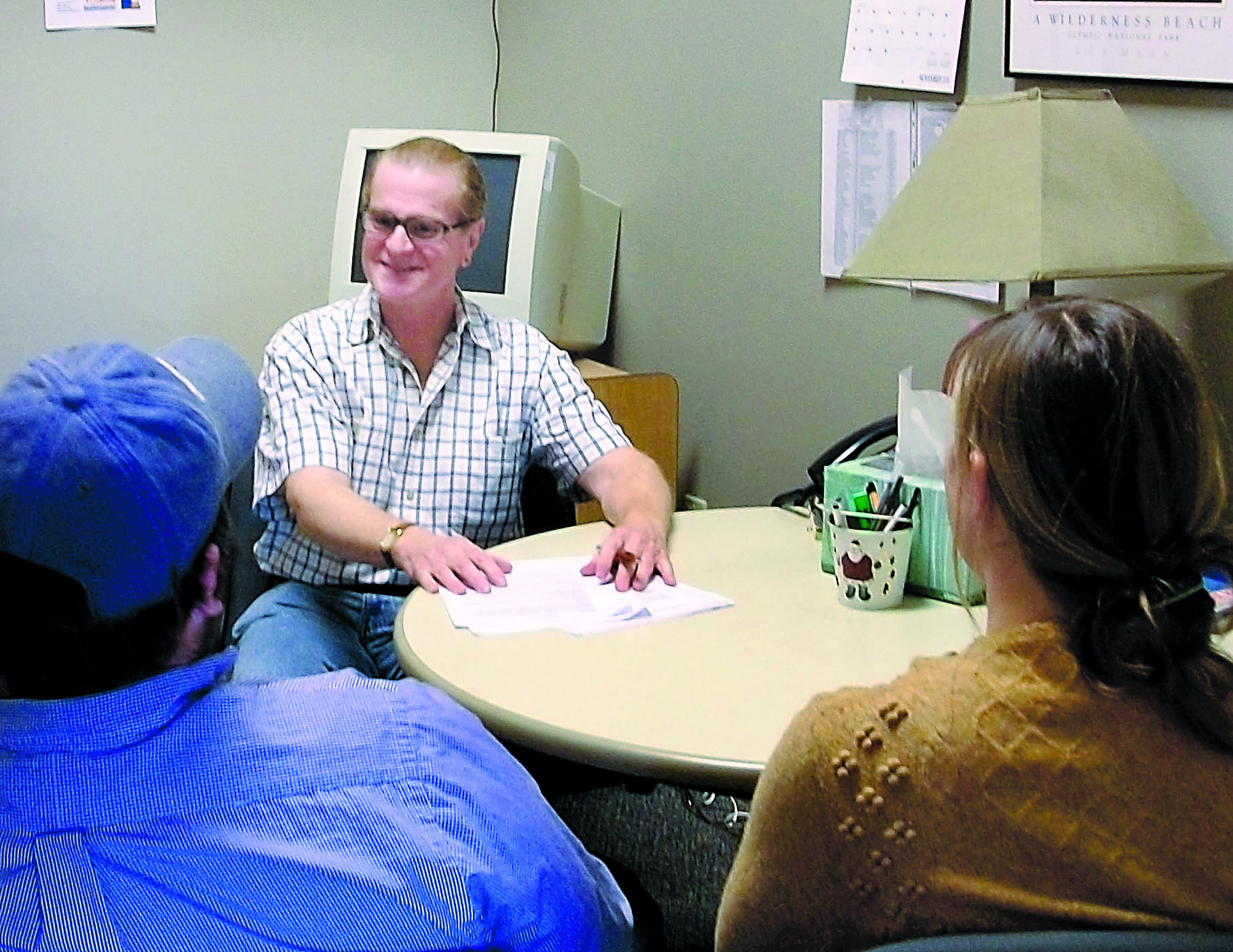 Rich Ciccarone meets with clients in the OlyCAP/Home Fund office in Port Townsend in 2010