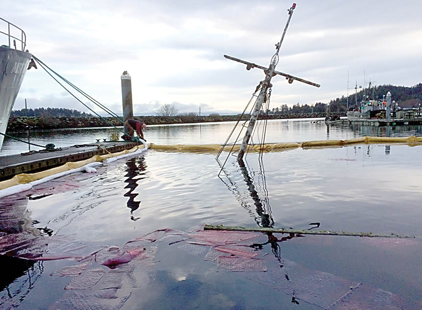 The 65-foot fishing vessel Black Fish is pictured after sinking at the Makah Marina in Neah Bay on Thursday. — U.S. Coast Guard