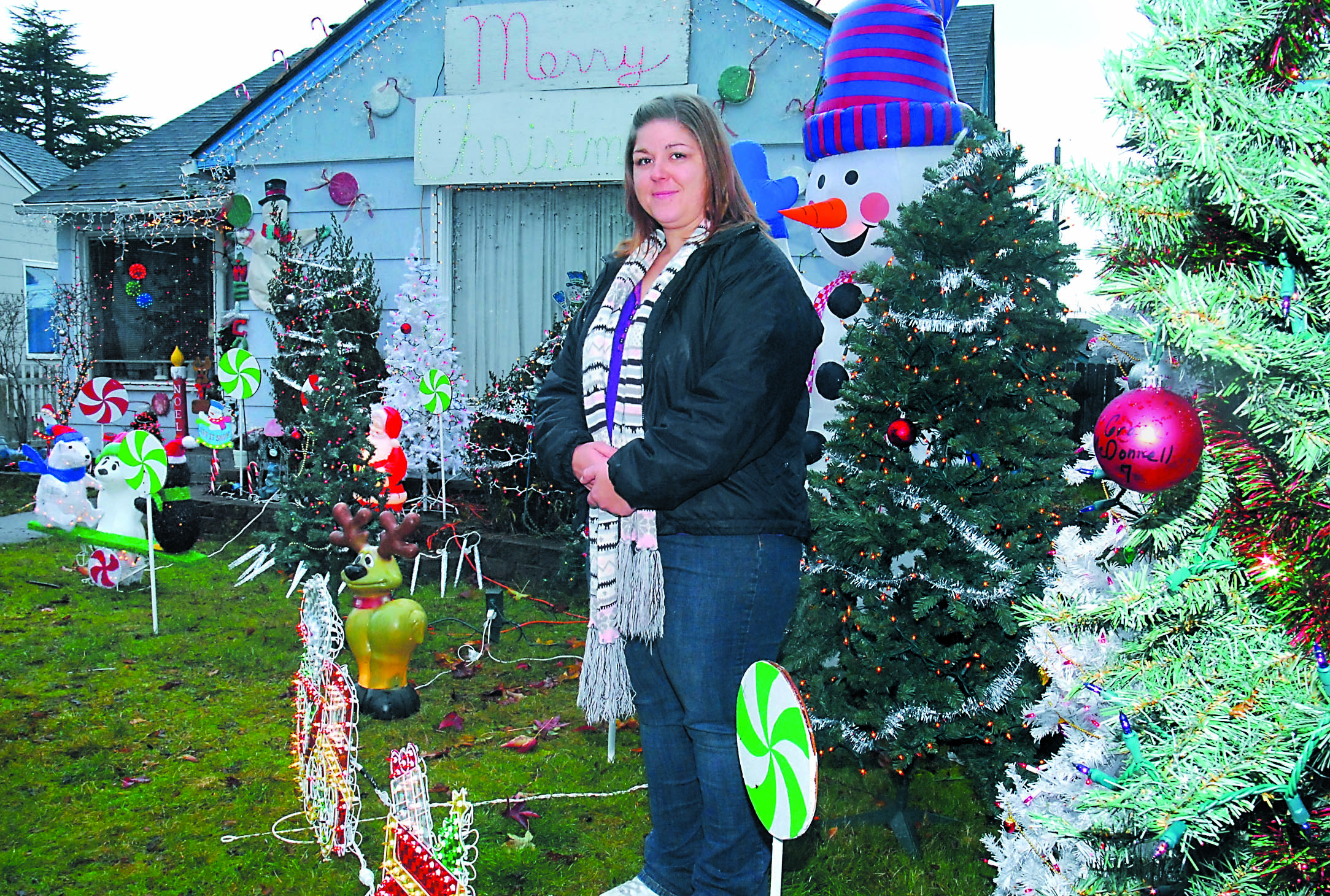 Ivy Mathison has placed ornaments honoring children killed in the Newtown