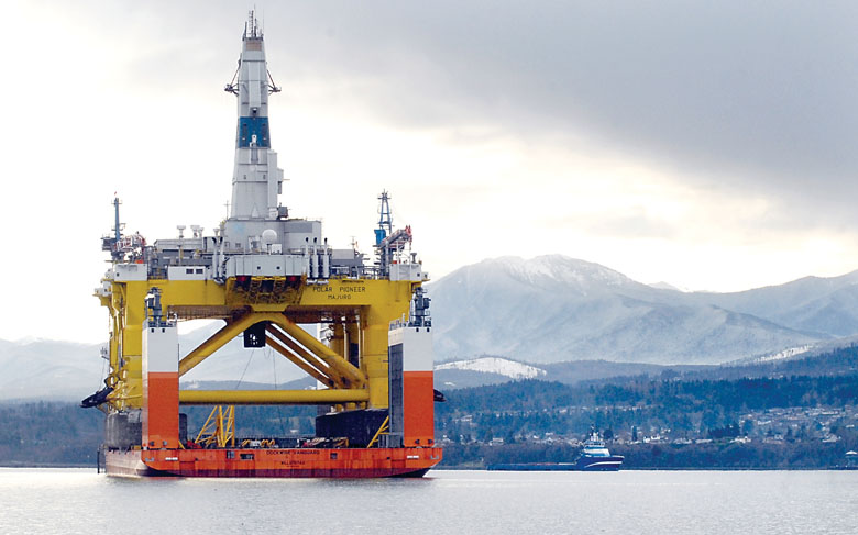 The oil drilling platform Polar Pioneer sits atop the semi-submersible transport ship Dockwise Vanguard in Port Angeles Harbor on Tuesday. — Keith Thorpe/Peninsula Daily News