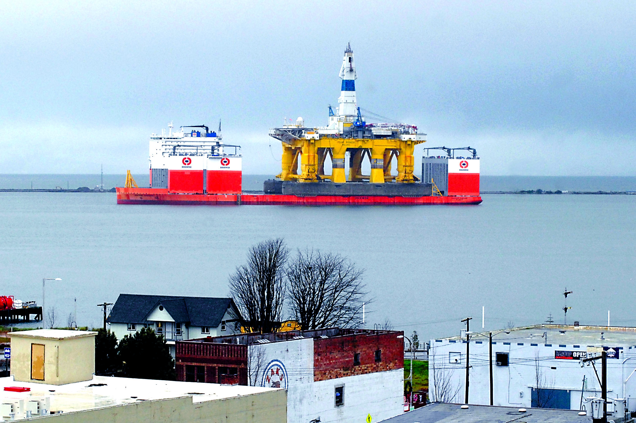 The oil drilling platform Polar Pioneer sits atop the semi-submersible heavy-lift transport ship Dockwise Vanguard on Wednesday in Port Angeles Harbor. — Keith Thorpe/Peninsula Daily News