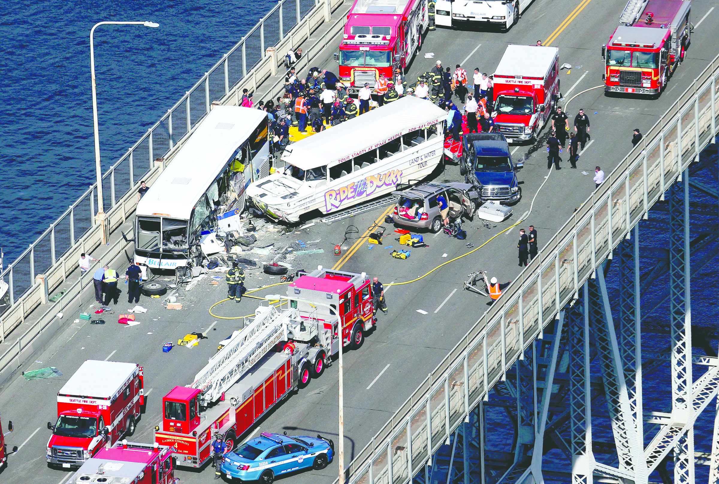 Emergency crews work at the scene of a fatal collision involving a charter bus