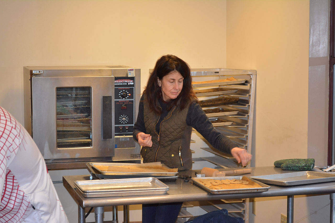 Volunteer Janet Skene works at the Gatheringplace in Port Townsend. (Mark Krulish/for Peninsula Daily News)