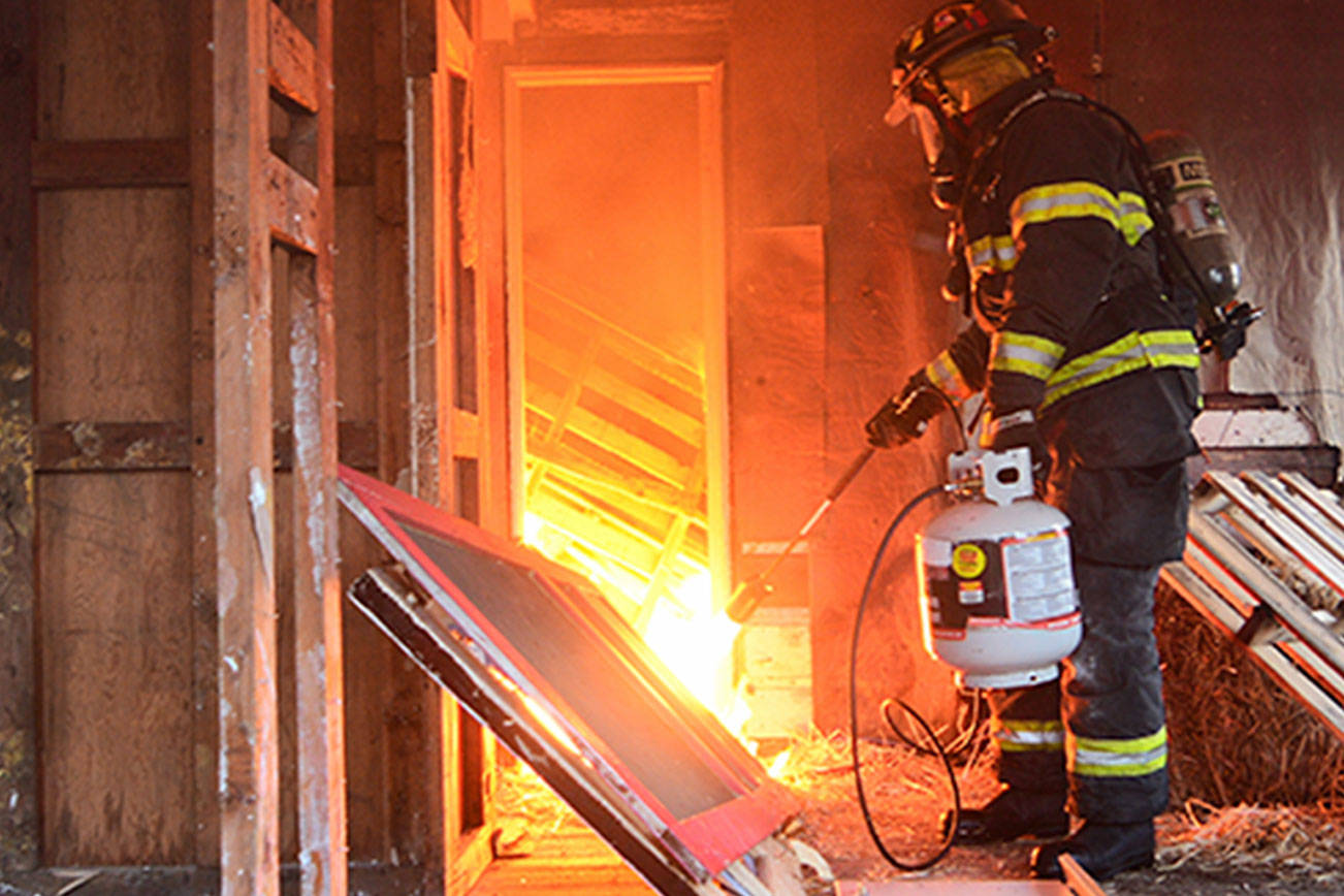 PHOTO GALLERY: Fire protection agencies, Fire Explorer Scouts train on practice fires in Port Angeles