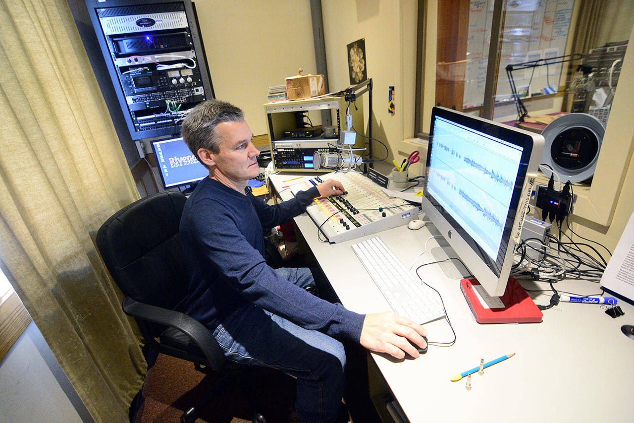 Robert Ambrose, KPTZ board chair and interim general manager, works on a project in a studio Wednesday. (Jesse Major/Peninsula Daily News)