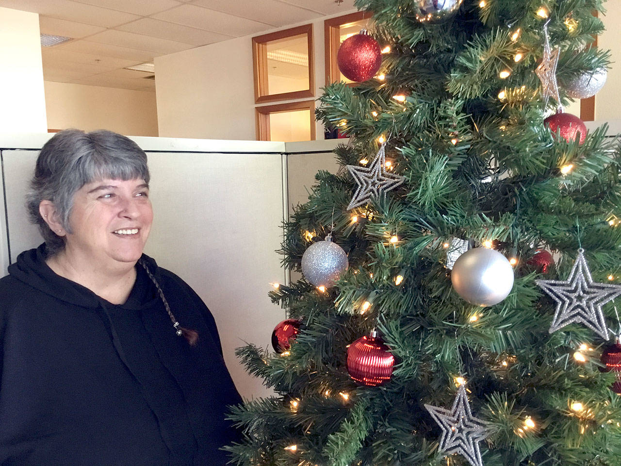 OlyCap’s Diana Assumpcao has a job she loves: distributing Peninsula Home Fund assistance to young families with children. (Jeannie McMacken/for Peninsula Daily News)