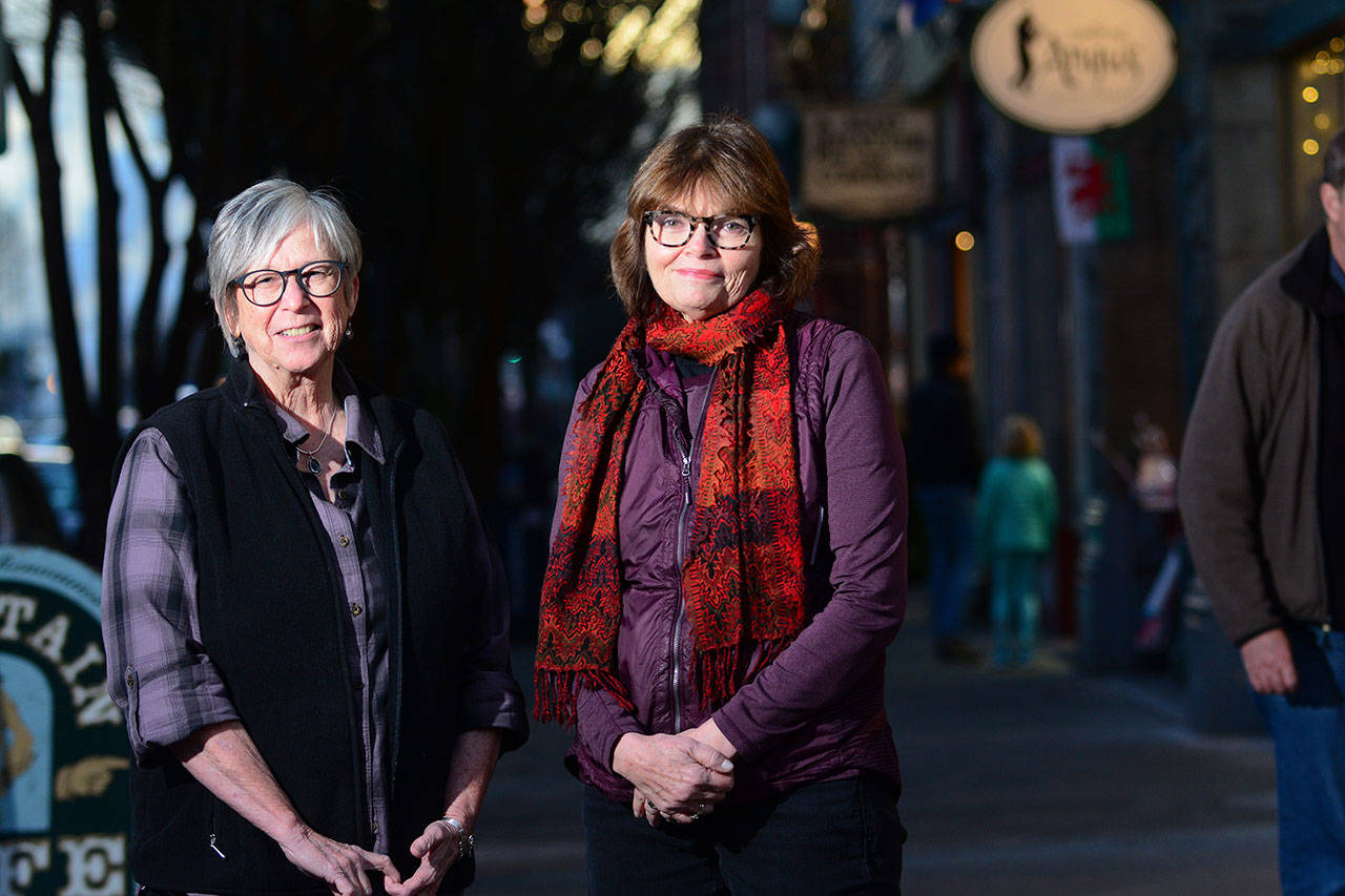 Sandy Spencer, Port Townsend Main Street board member, left, and Executive Director Mari Mullen are preparing a campaign to help downtown businesses thrive during the six months of Water Street construction that is scheduled to begin Jan. 2. (Jesse Major/Peninsula Daily News)