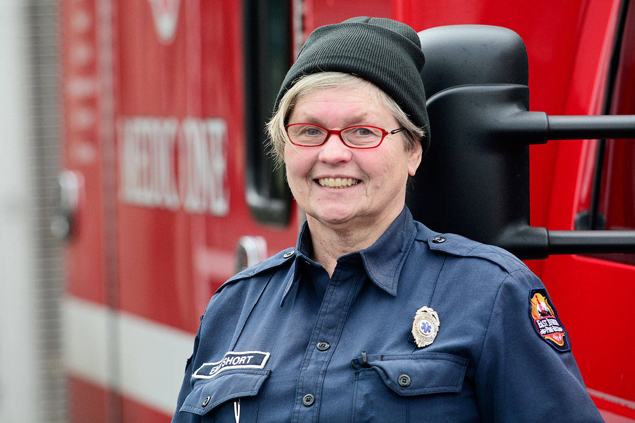 Sandy Short, a volunteer EMT for East Jefferson Fire-Rescue, led an effort to honor two Jefferson County firefighters who died fighting fires more than 50 years ago. (Jesse Major/Peninsula Daily News) ​