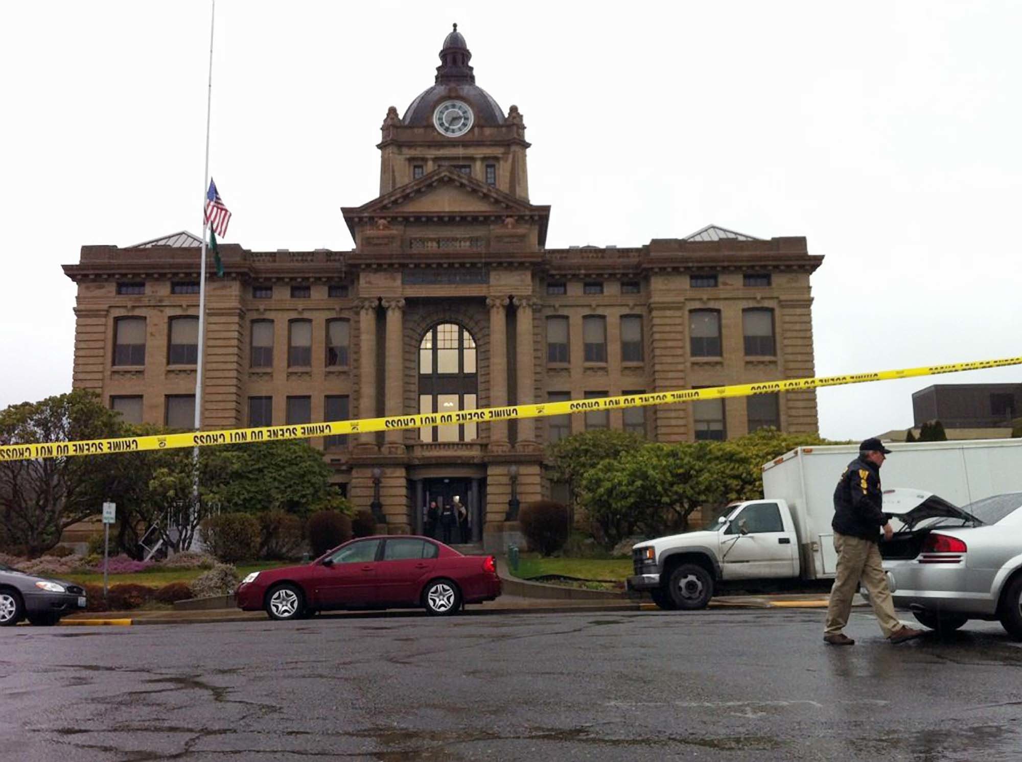 Authorities are searching for the man who stabbed a Superior Court judge and shot a sheriff's deputy in the Grays Harbor County Courthouse in Montesano. Mark Harrison/The Seattle Times (via Associated Pr