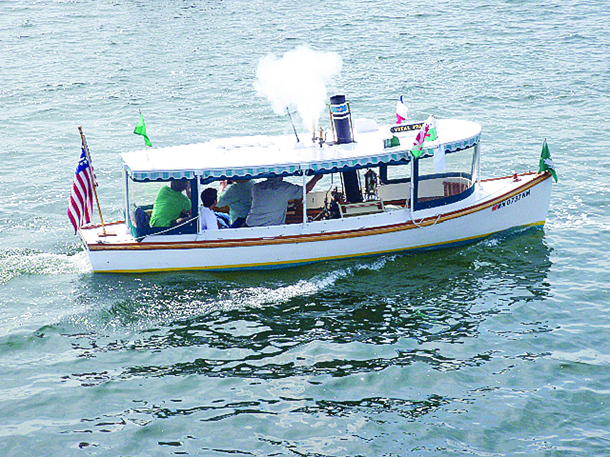 John Hope blows the whistle during an excursion in Vital Spark