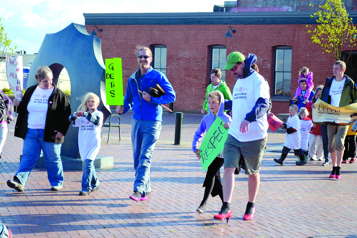 More than 100 people participated in the “Walk A Mile in Her Shoes” event on Wednesday