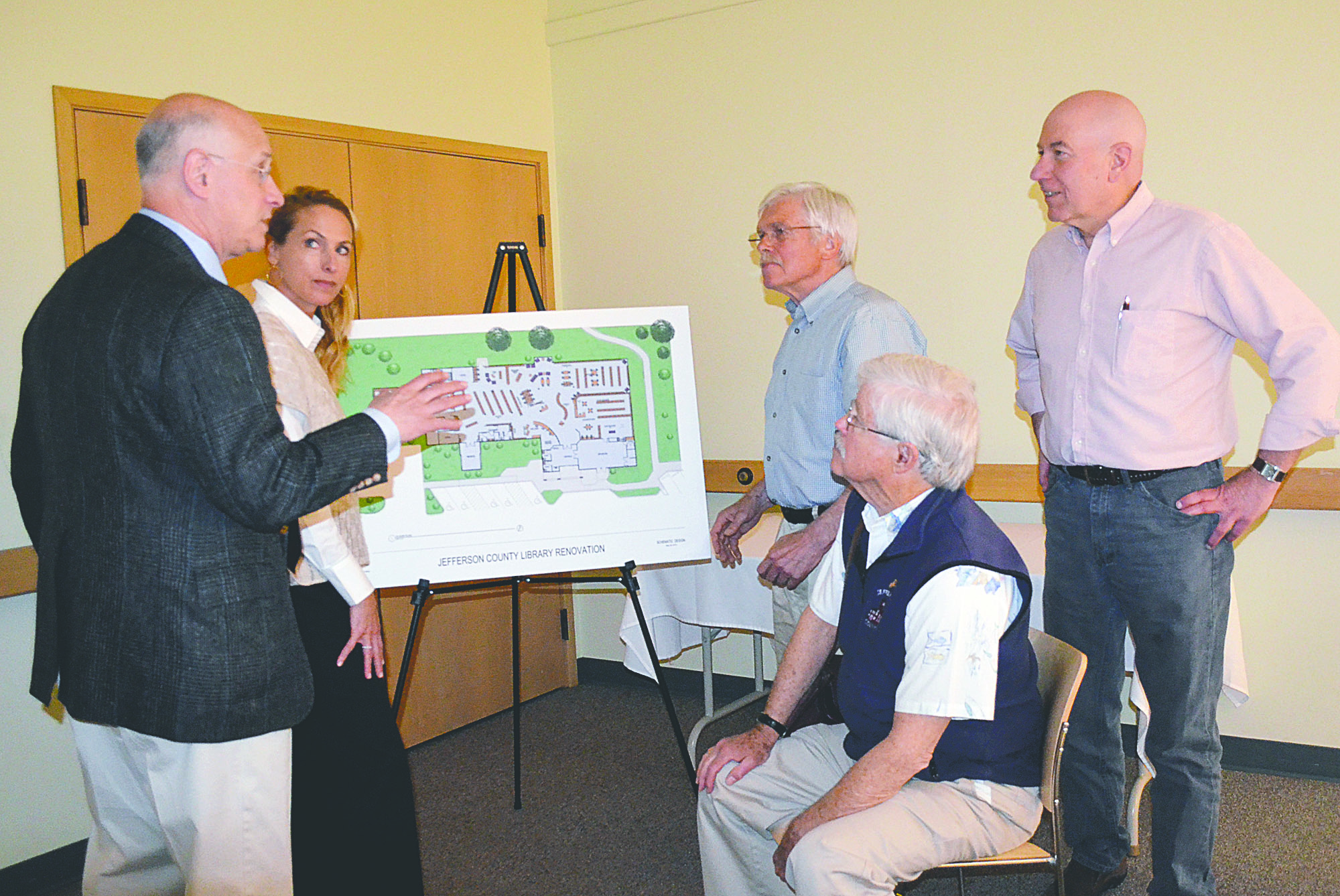 Jefferson County Library Director Ray Serebrin and assistant director Meredith Wagner go over the library's renovation plans with Jefferson County Commissioners Phil Johnson