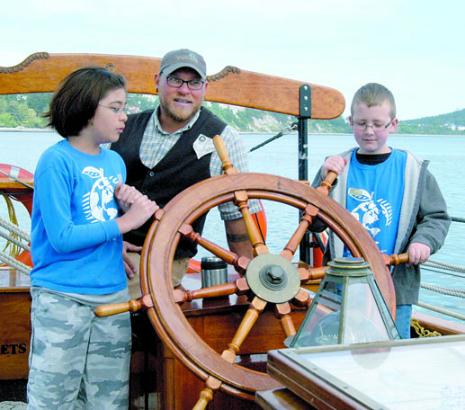 Joshua Berger leads a field trip on the 'Adventuress' last summer with TJ Brennan