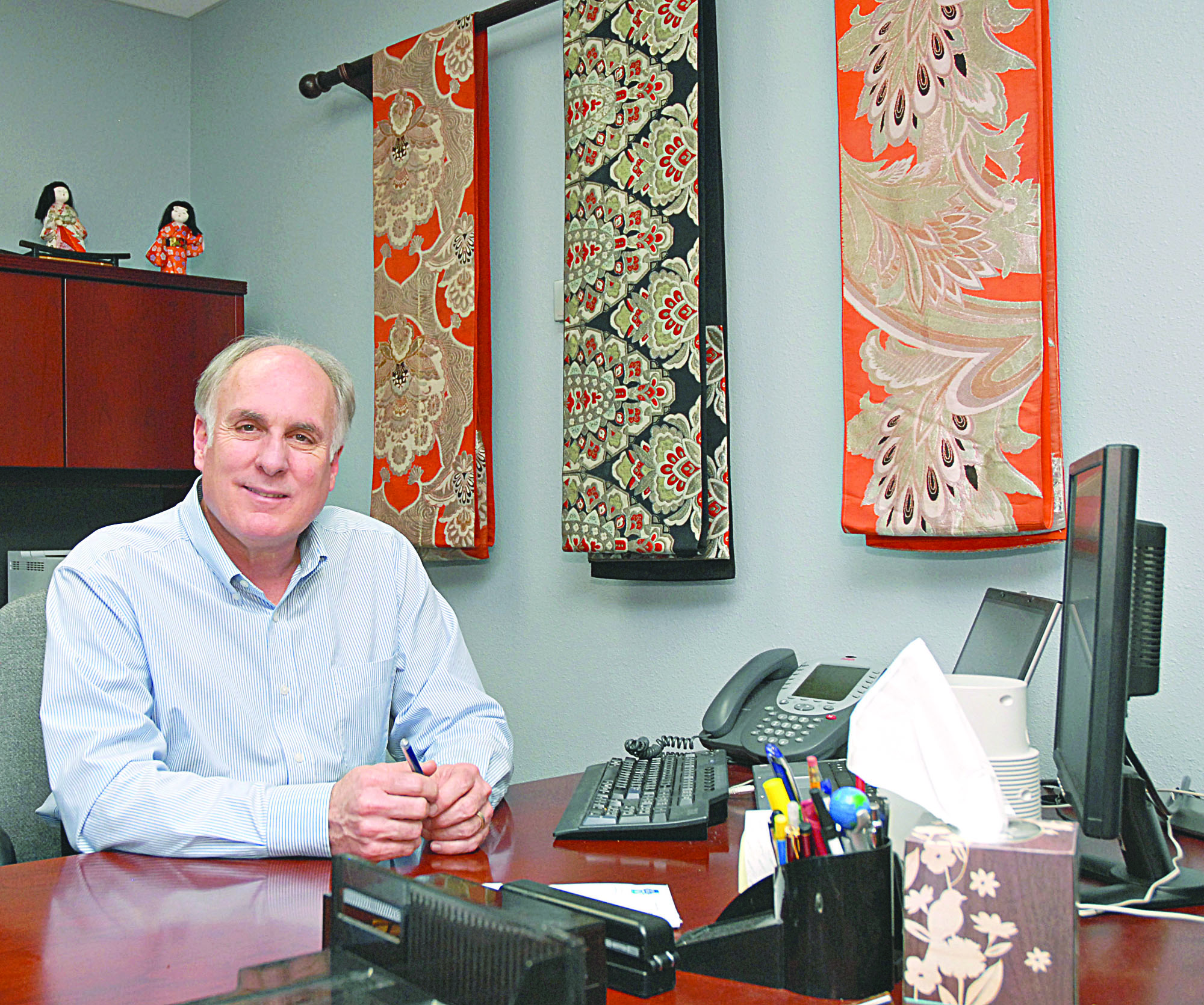 Port Angeles City Manager Kent Myers sits at his City Hall office desk in March 2011