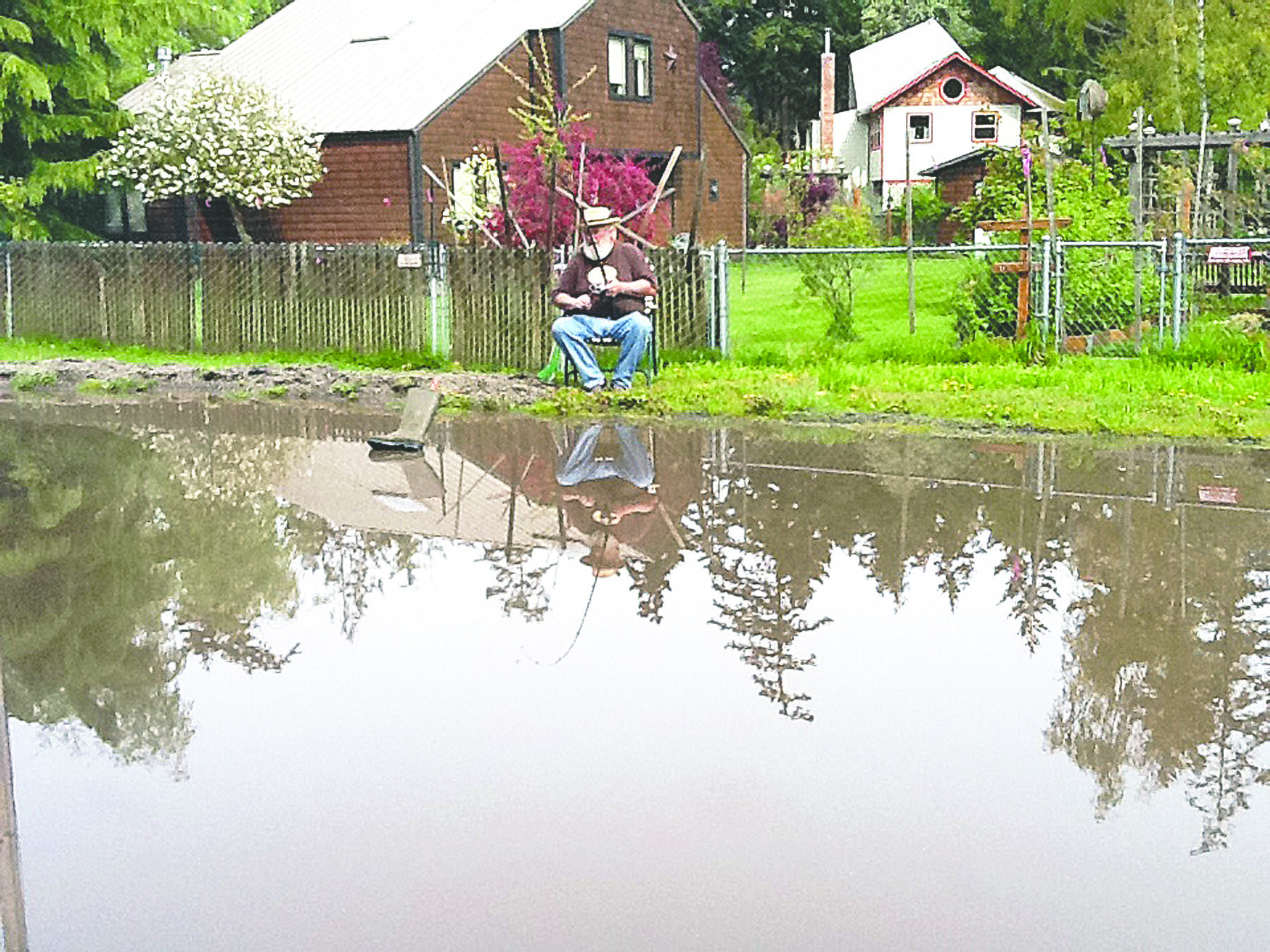 Brian Norvell fishes next to his house on Center Street in Port Townsend