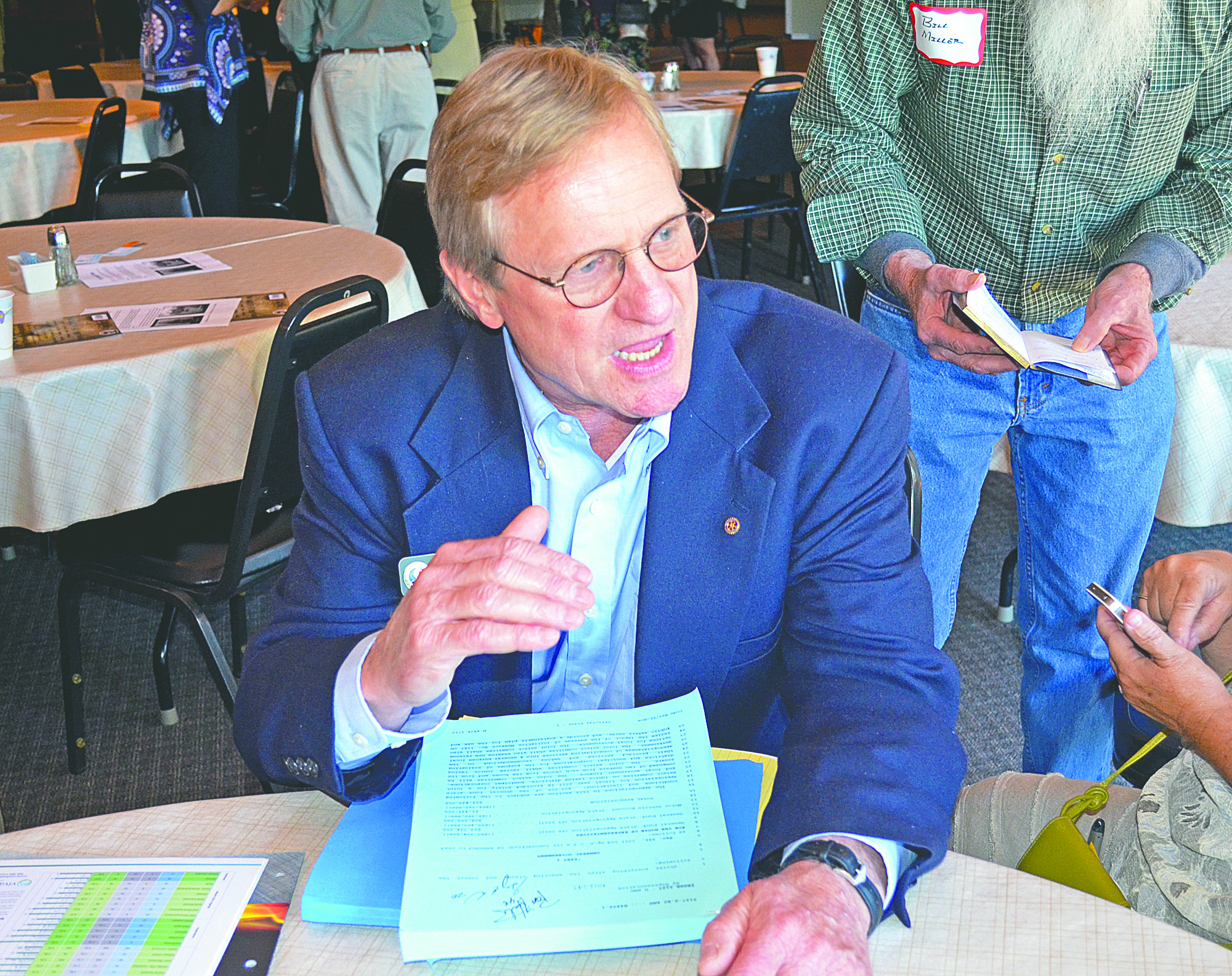 State Rep. Steve Tharinger shows the recently passed state budget to members of the Jefferson County Chamber of Commerce on Monday.  -- Photo by Charlie Bermant/Peninsula Daily News