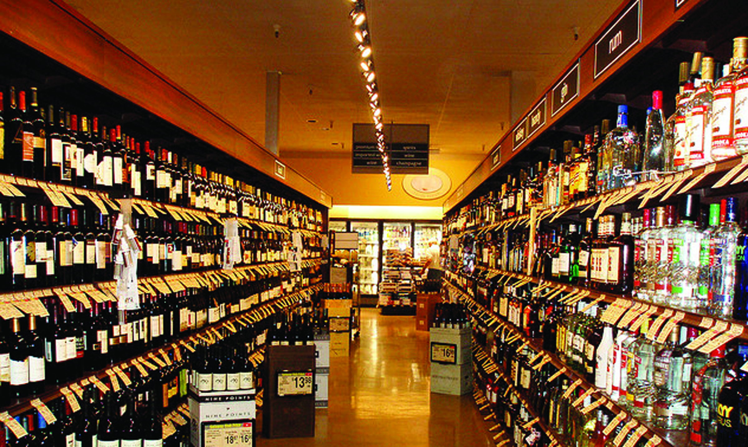 Shelves displaying hard liquor for sale are shown in this California Safeway store. Safeway stores on the North Olympic Peninsula are among outlets selling spirits for the first time in Washington state history today. -- Special to Peninsula Daily News