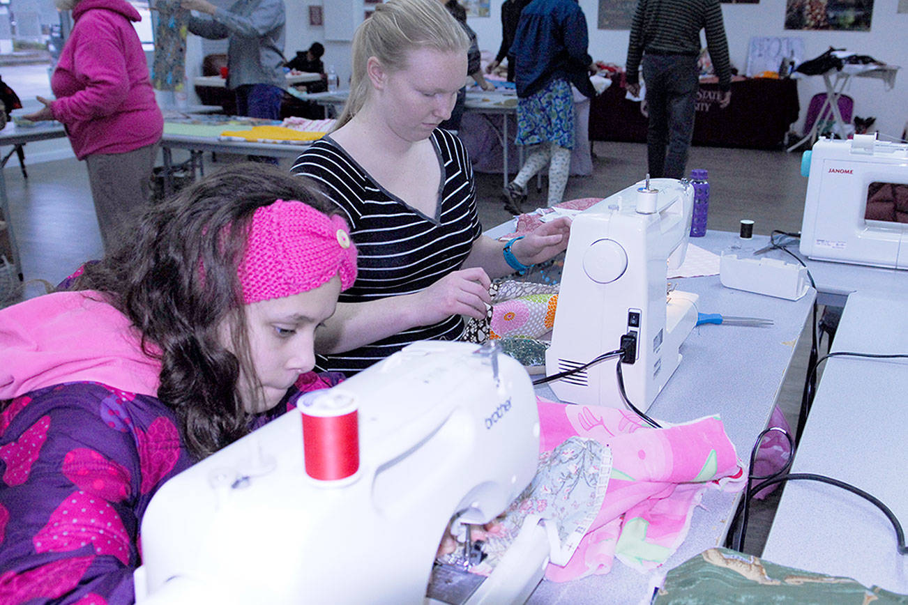 Jefferson County 4-Hers sew kennel beds for animal shelters