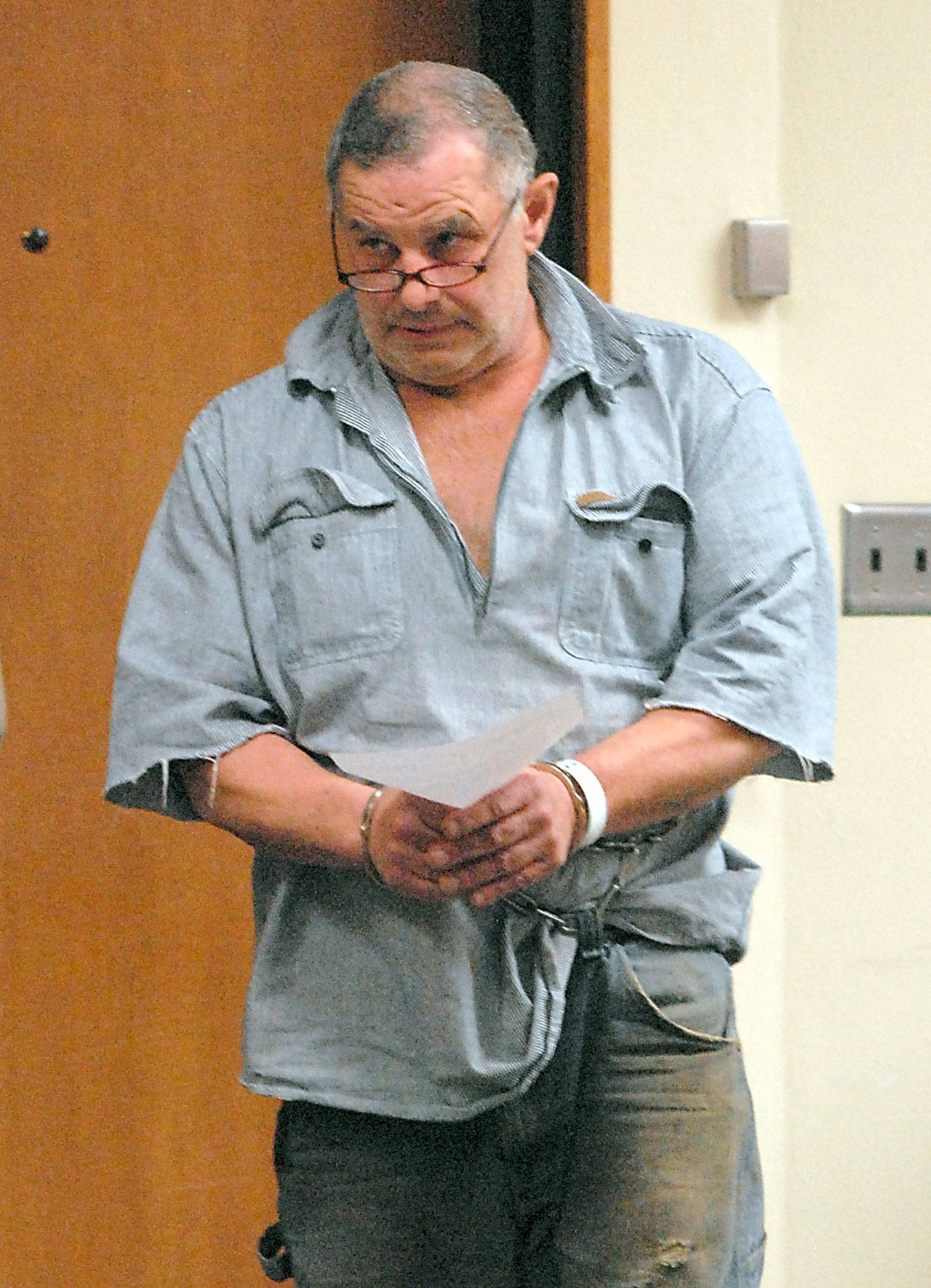 Roger Garman of Sequim enters Clallam County Superior Court in Port Angeles in connection with alleged threats made to a Jamestown S’Klallam school bus driver and the tribal office. (Keith Thorpe/Peninsula Daily News) Roger Garman of Sequim enters Clallam County Superior Court in Port Angeles. (Keith Thorpe/Peninsula Daily News)