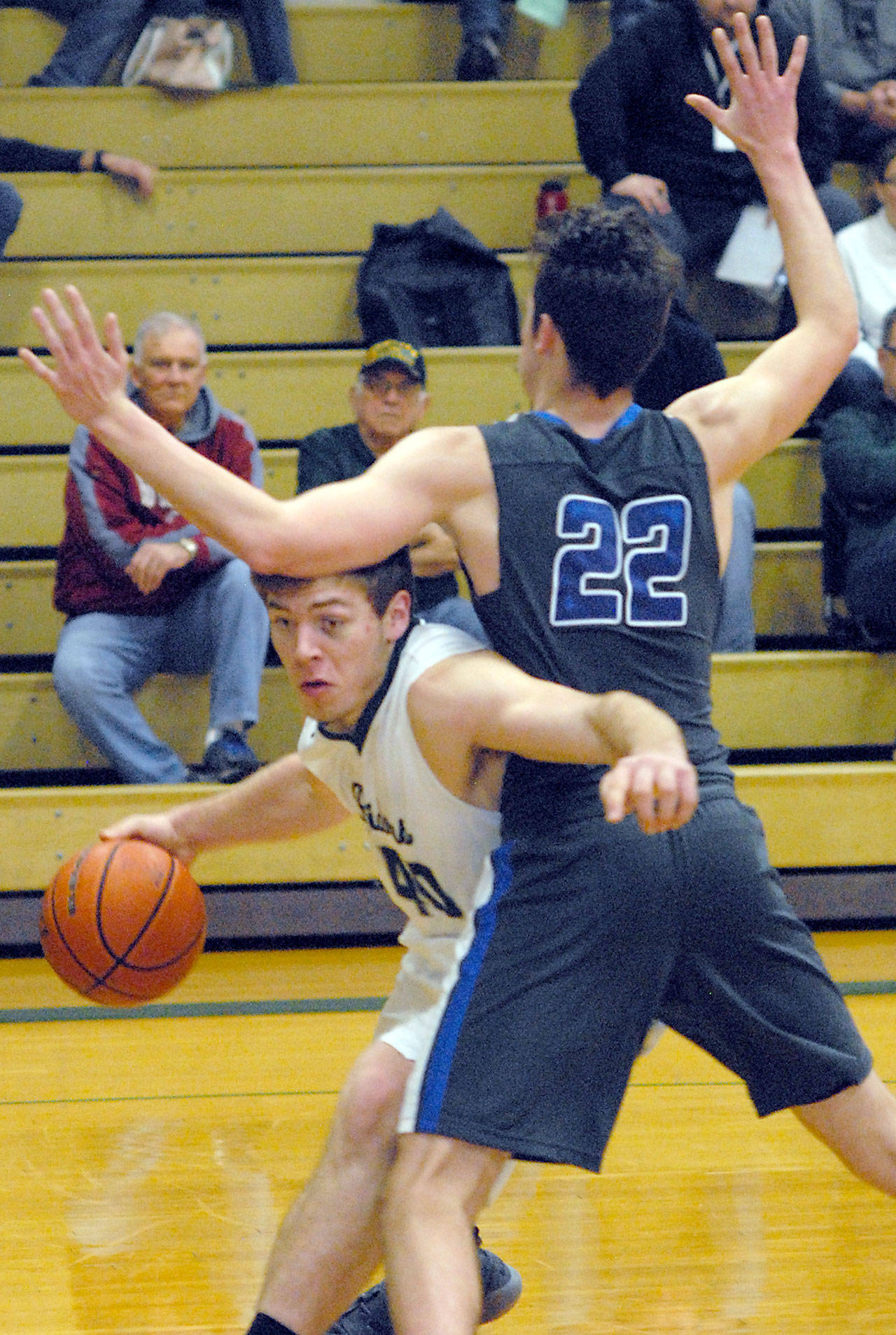 Port Angeles’ Anton Kathol, left, works his way around the defense of Olympic’s Keaton Dean during the Riders’ 50-39 win Friday. Keith Thorpe/Peninsula Daily News