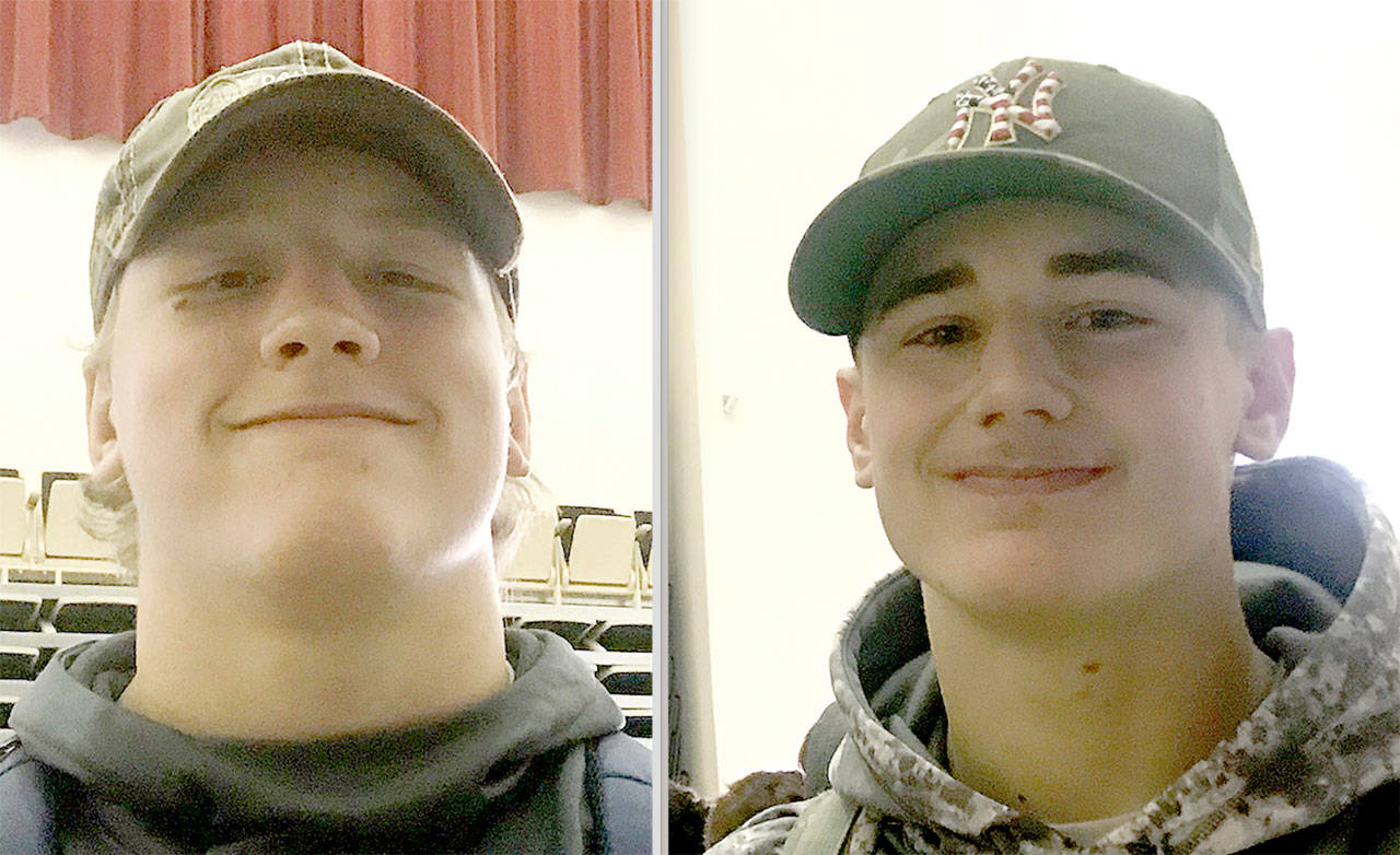 Luke Dahlgren, left and Colby Demorest, right, Forks wrestlers.